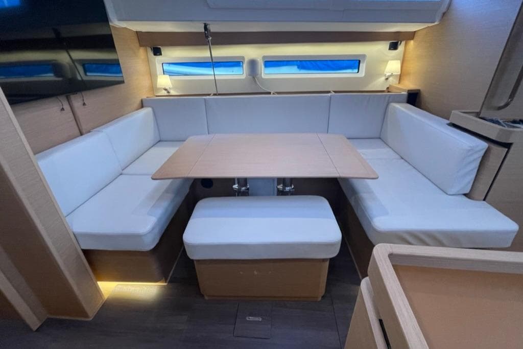 Setee and dining table. Table folds in to provide more leg room when not dining.