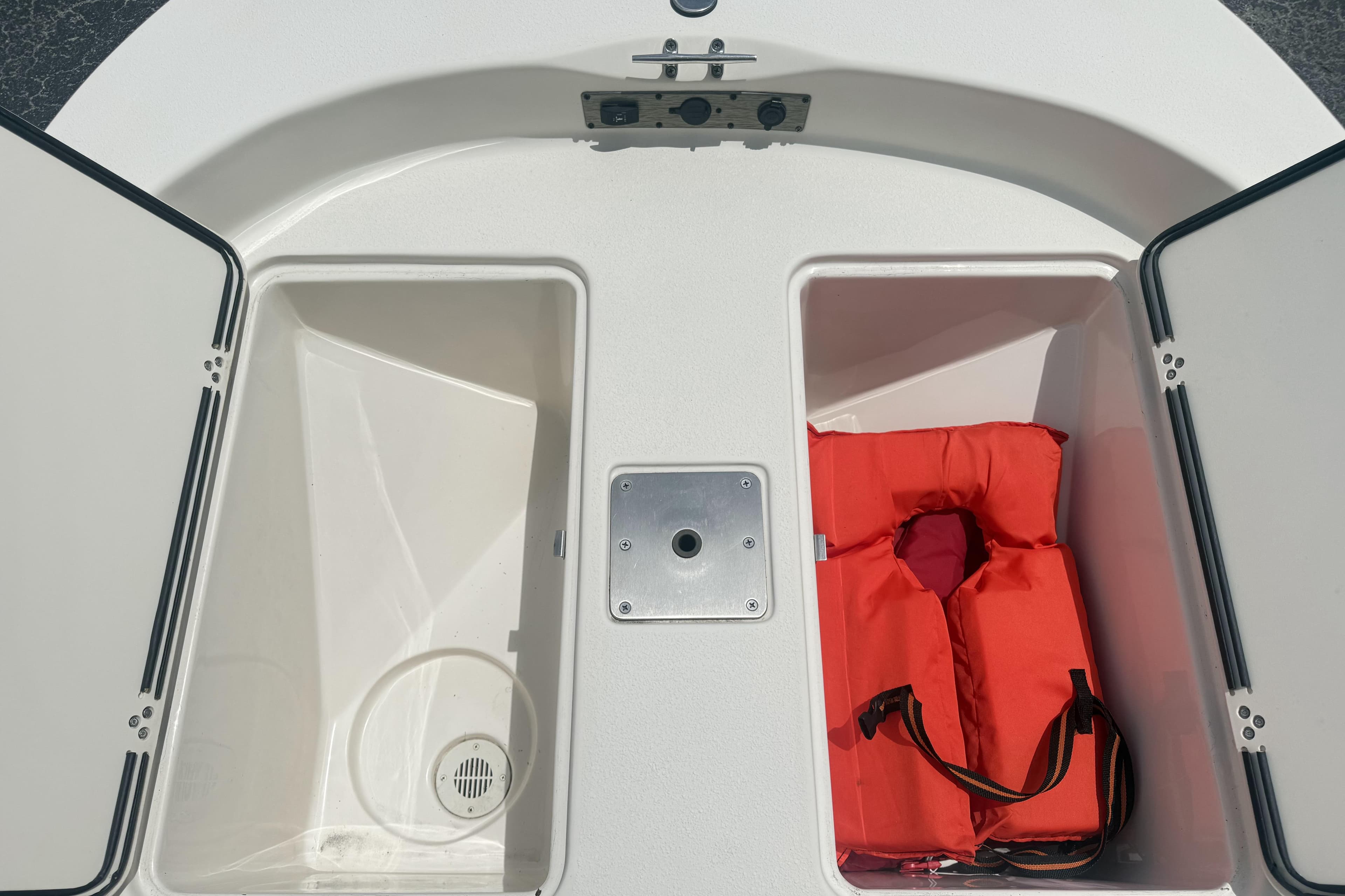 2023 Carolina Skiff 162 JLS storage compartments with life jacket.