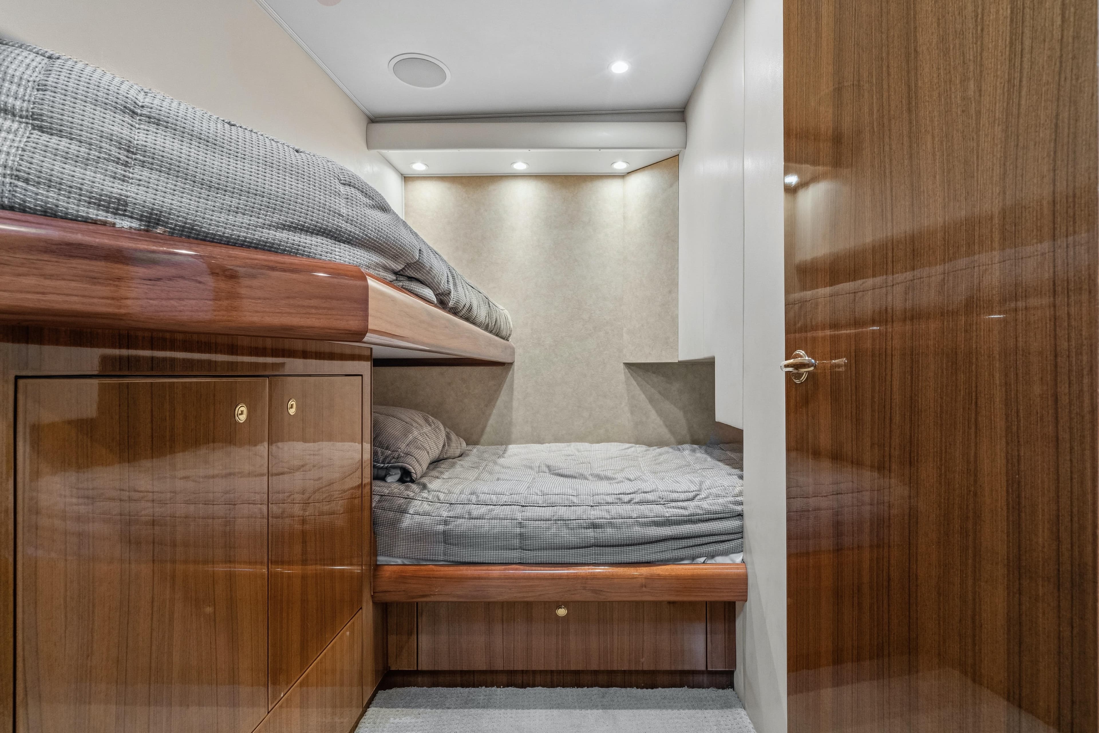 2007 Viking 56 Convertible yacht cabin with bunk beds and wooden cabinetry.