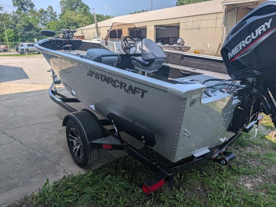 2026 Starcraft 166 Starfish boat on trailer with Mercury outboard motor.