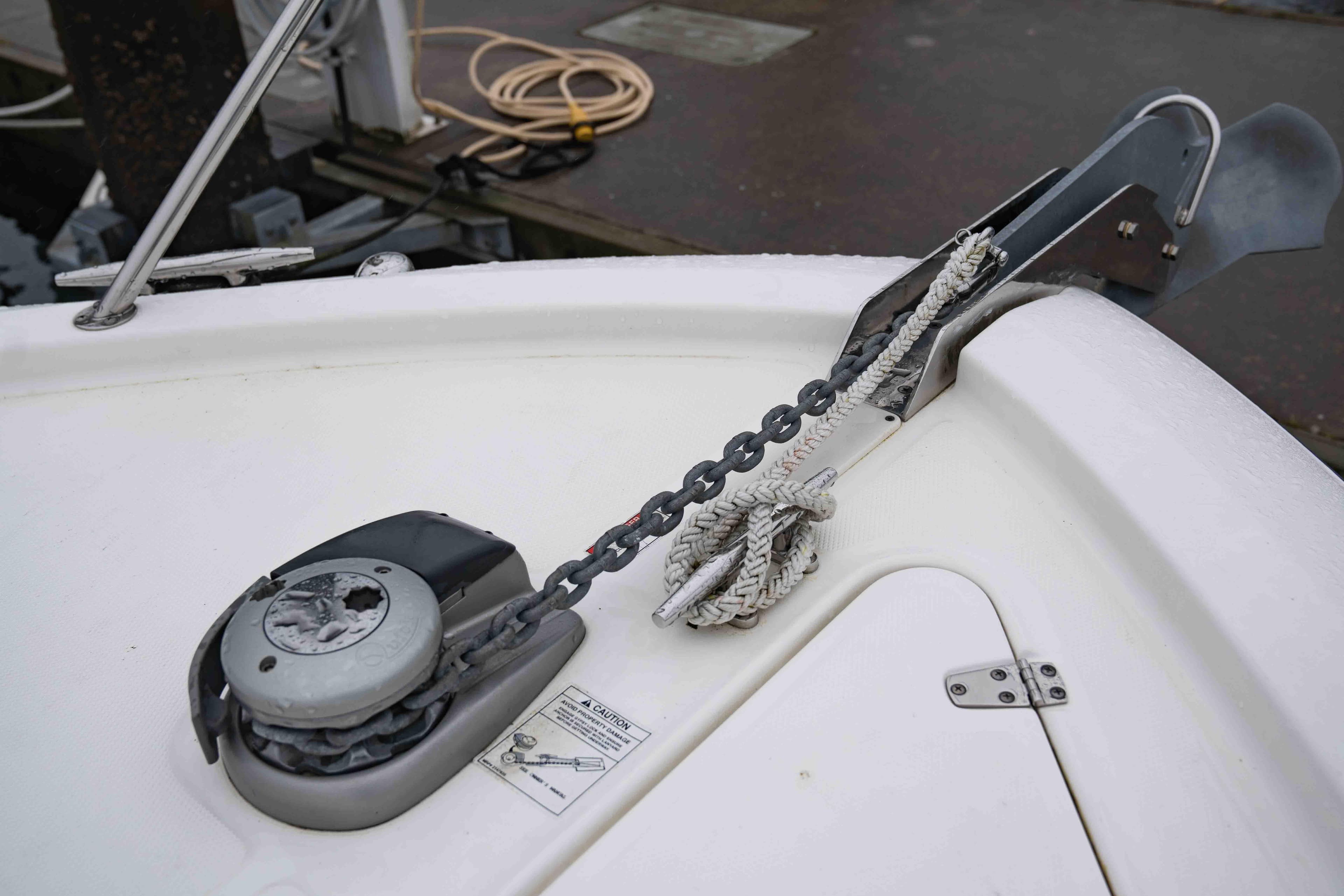 Anchor system on 2015 Boston Whaler 315 Conquest Pilothouse boat, featuring chain and rope.