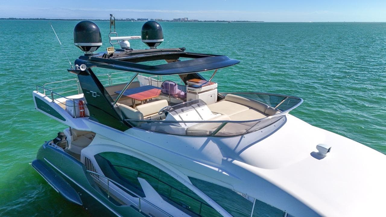 Azimut Flybridge 2012 yacht cruising on open sea, luxury vessel.