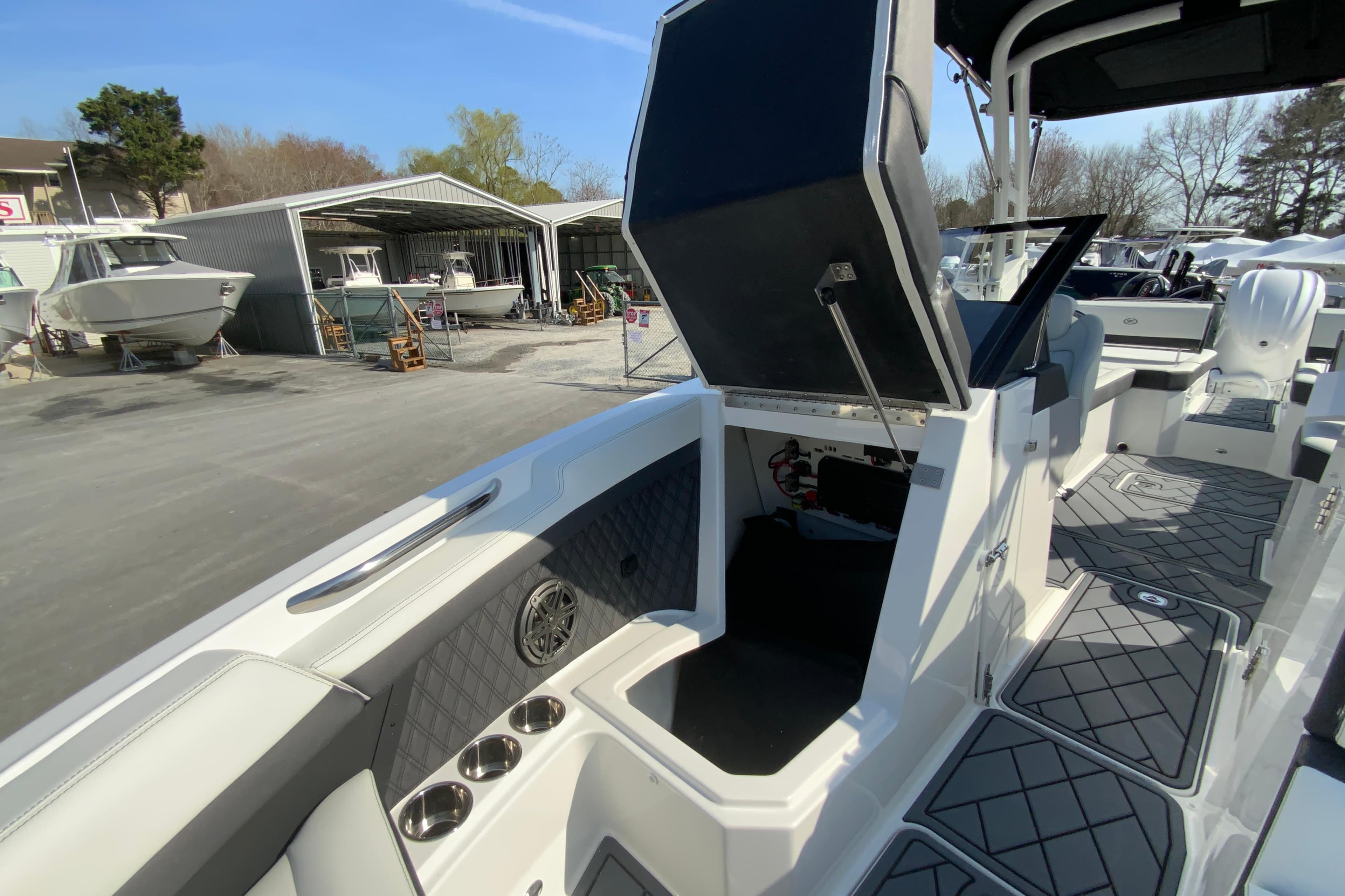 2026 Cobalt R6 Outboard boat interior with open storage compartment and sleek design.