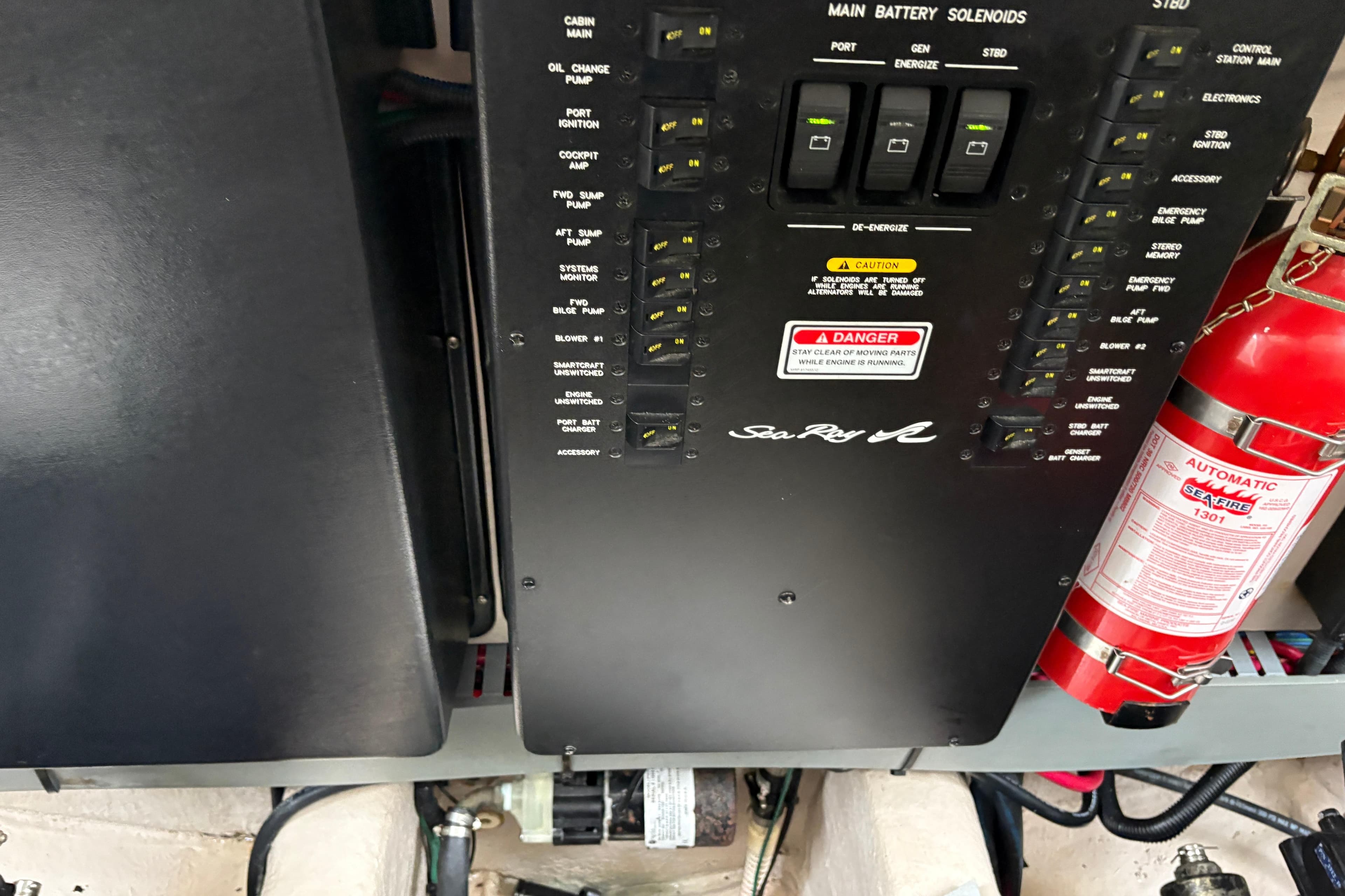 Control panel of a 2003 Sea Ray 360 Sundancer with fire extinguisher.
