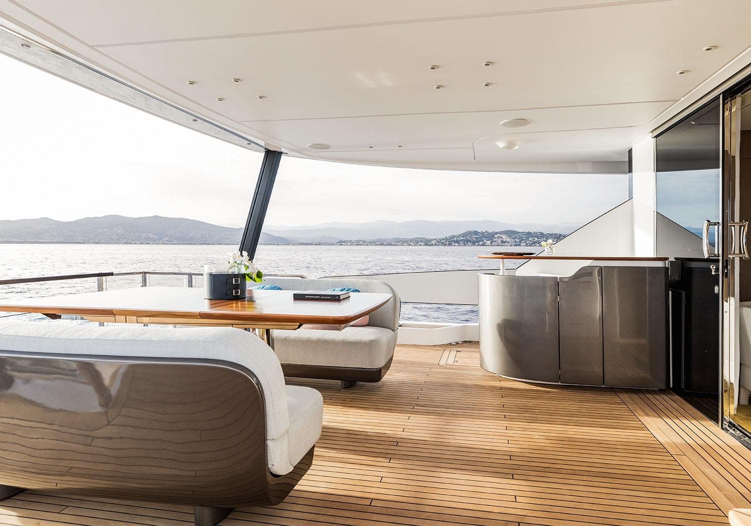 Luxurious 2025 Azimut Grande 26M yacht deck with elegant seating and scenic ocean view.