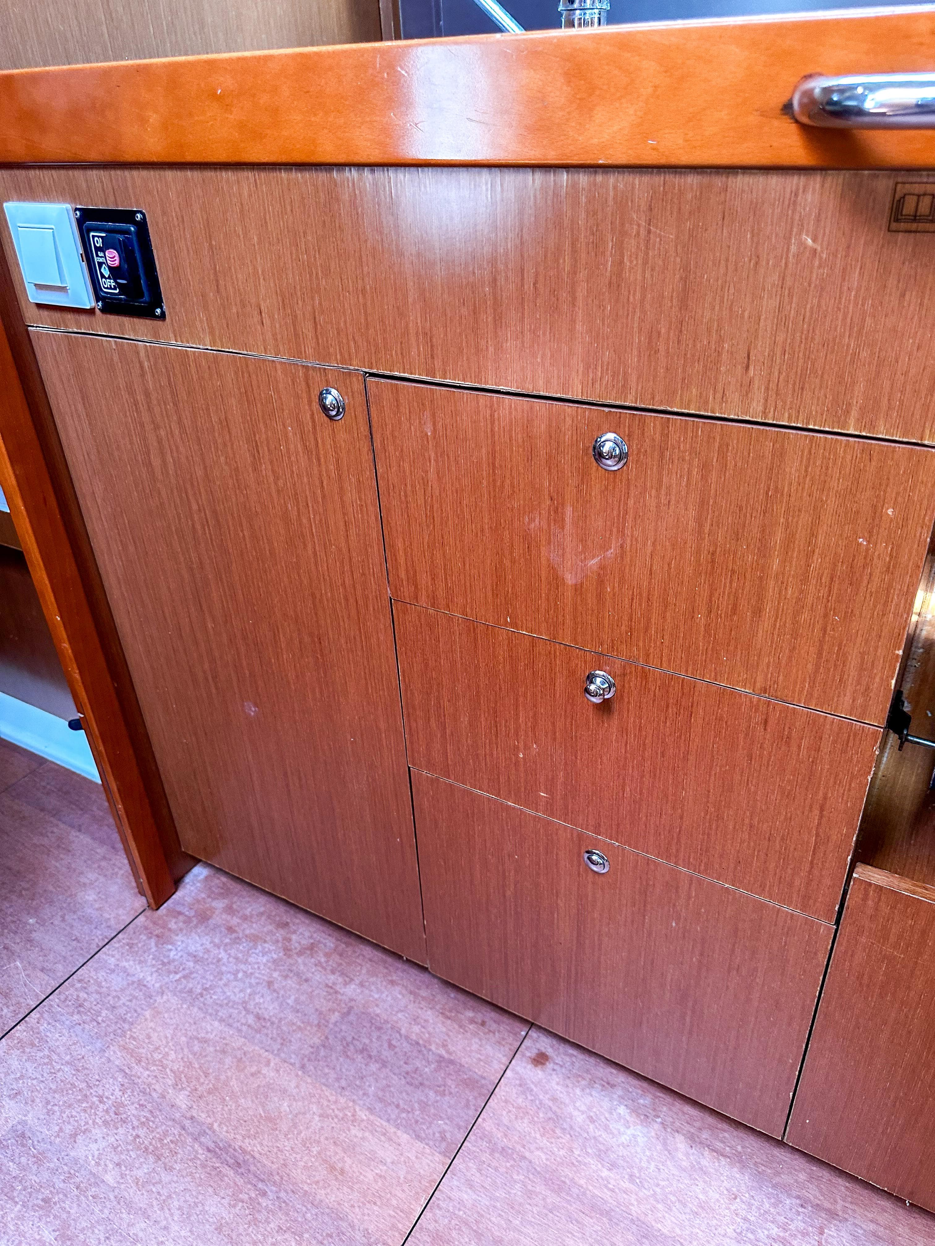 Wooden cabinetry in a 2018 Beneteau Oceanis 41.1 yacht interior.