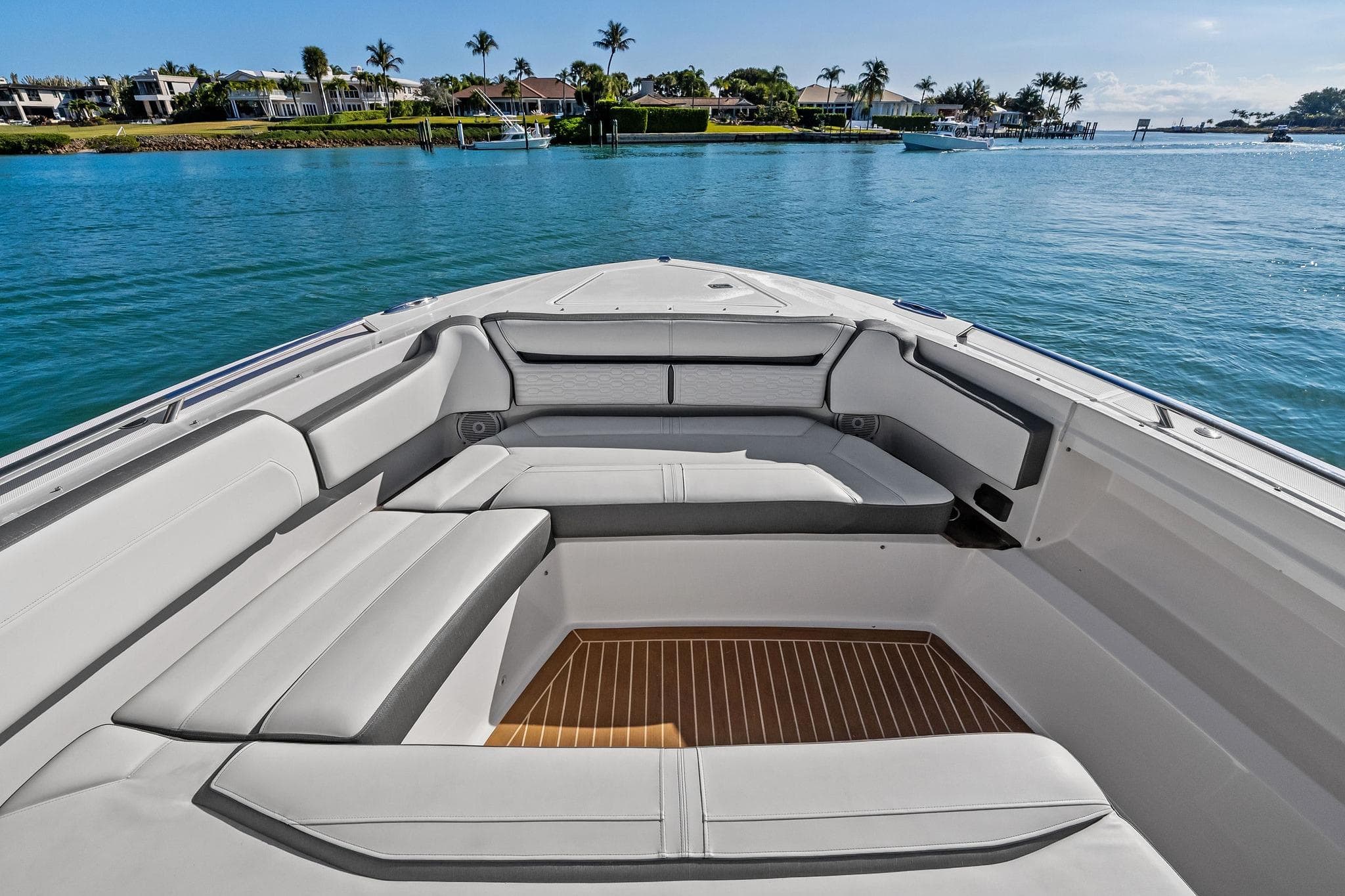 2019 Tiara Yachts 38 LS boat interior with luxurious seating and scenic water view.