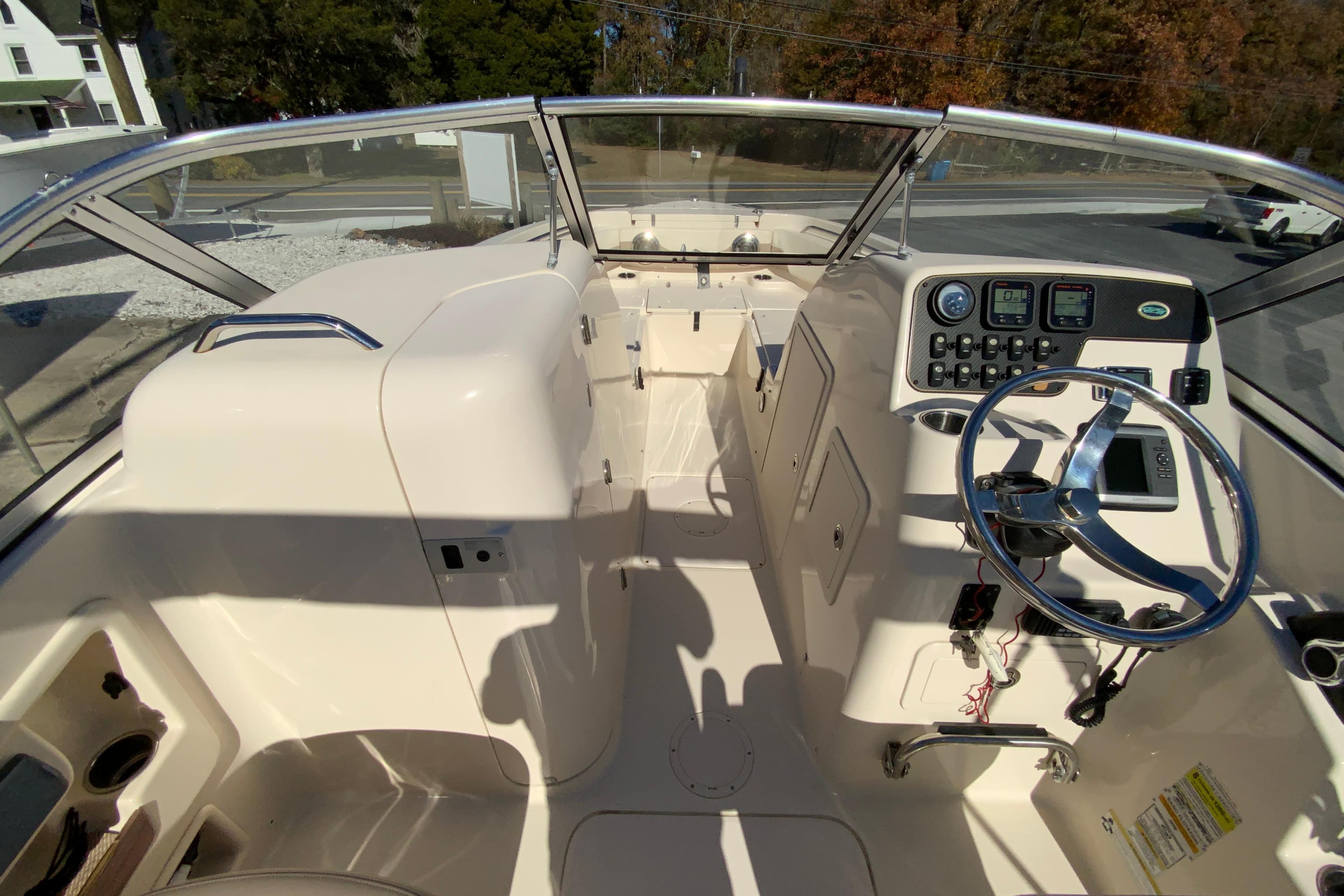 2014 Grady-White Freedom 225 boat interior with steering wheel and control panel.