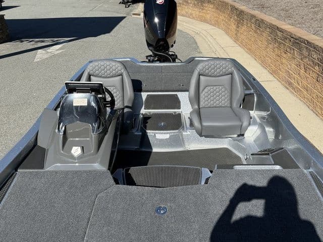 2026 Ikon Boats VLX20 interior with dual gray seats and modern dashboard.