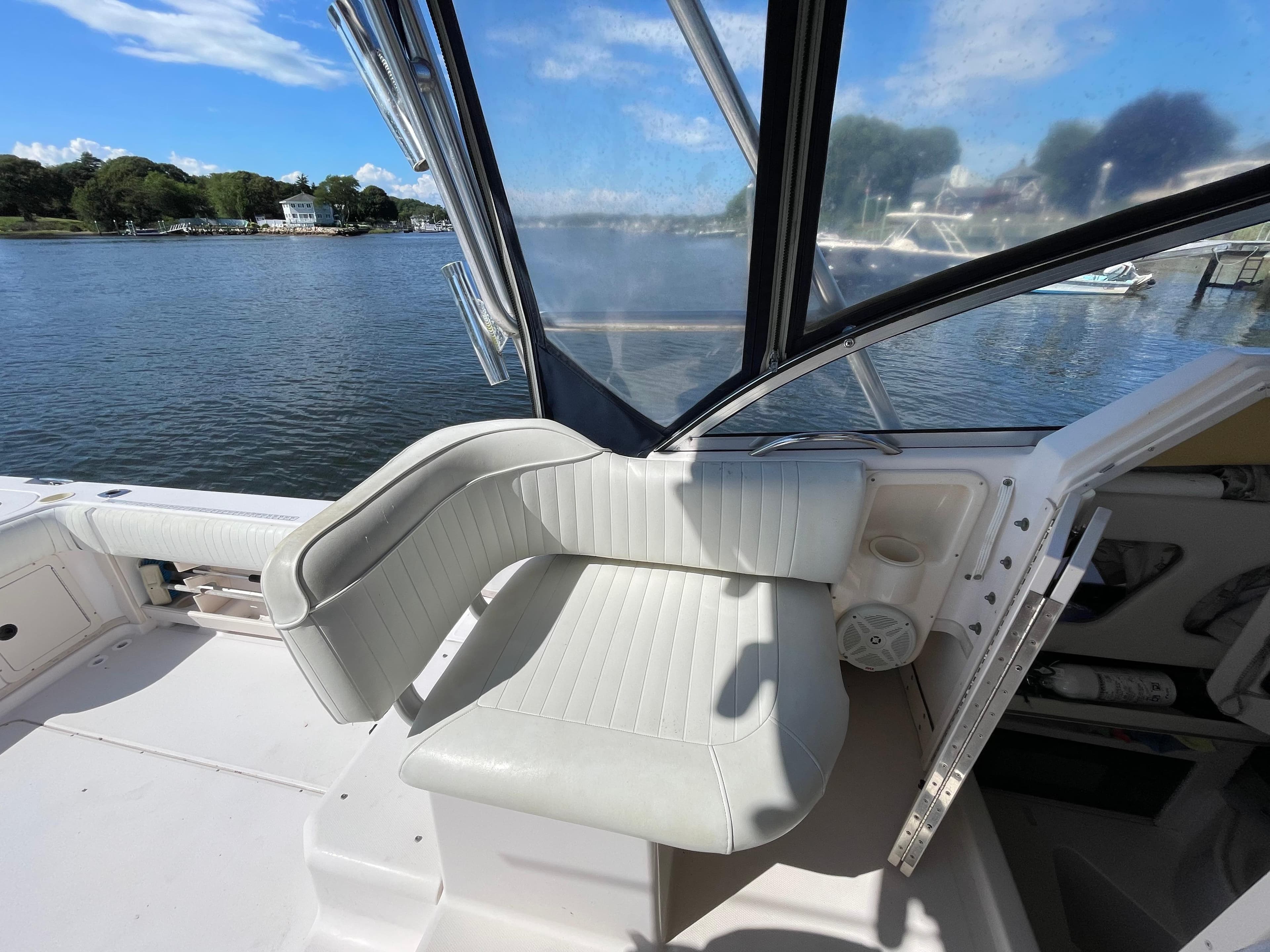 2001 Grady-White Sailfish 282 boat interior with white seating and waterfront view.