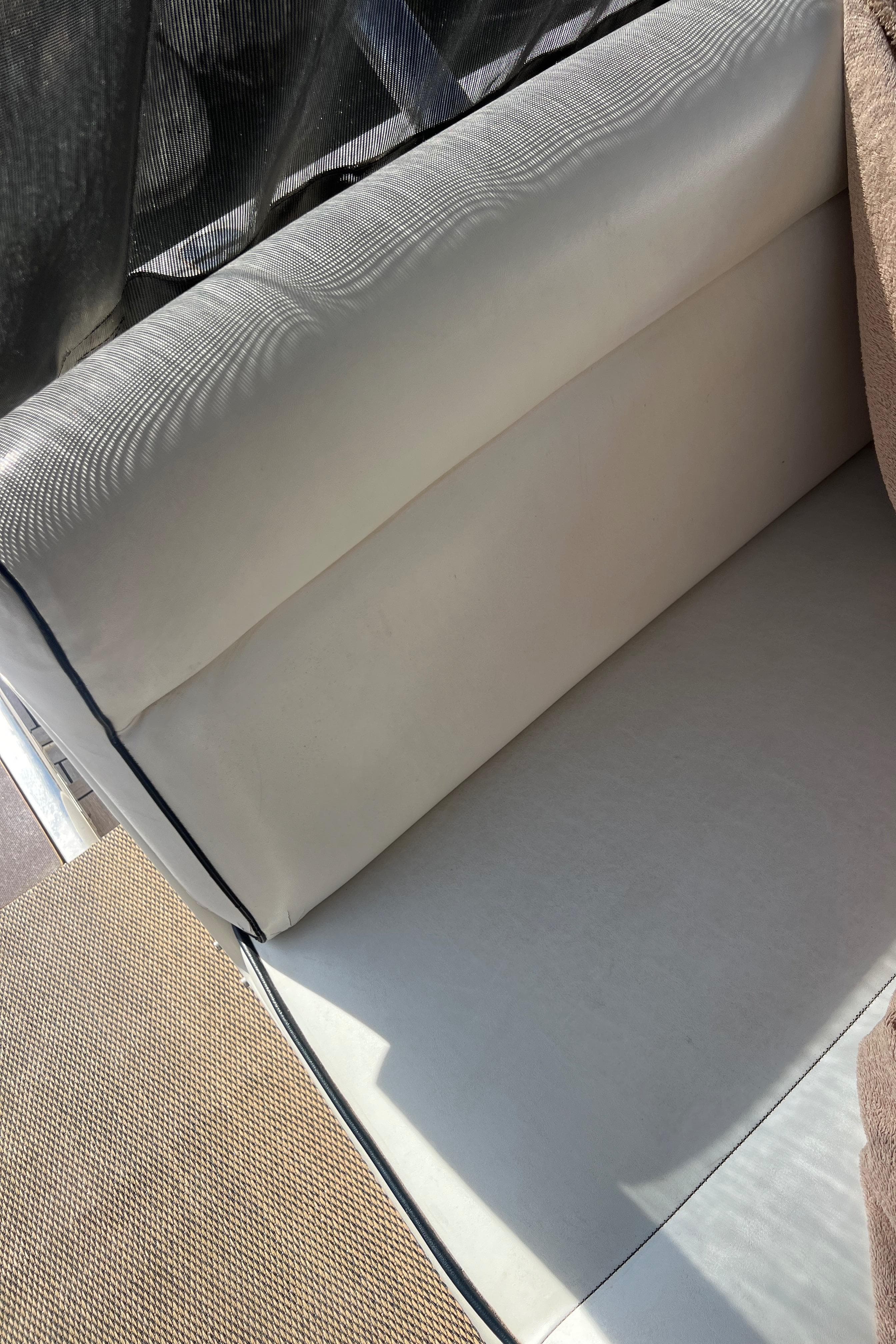 White leather seating on a 2008 Riviera 4700 Sport Yacht.