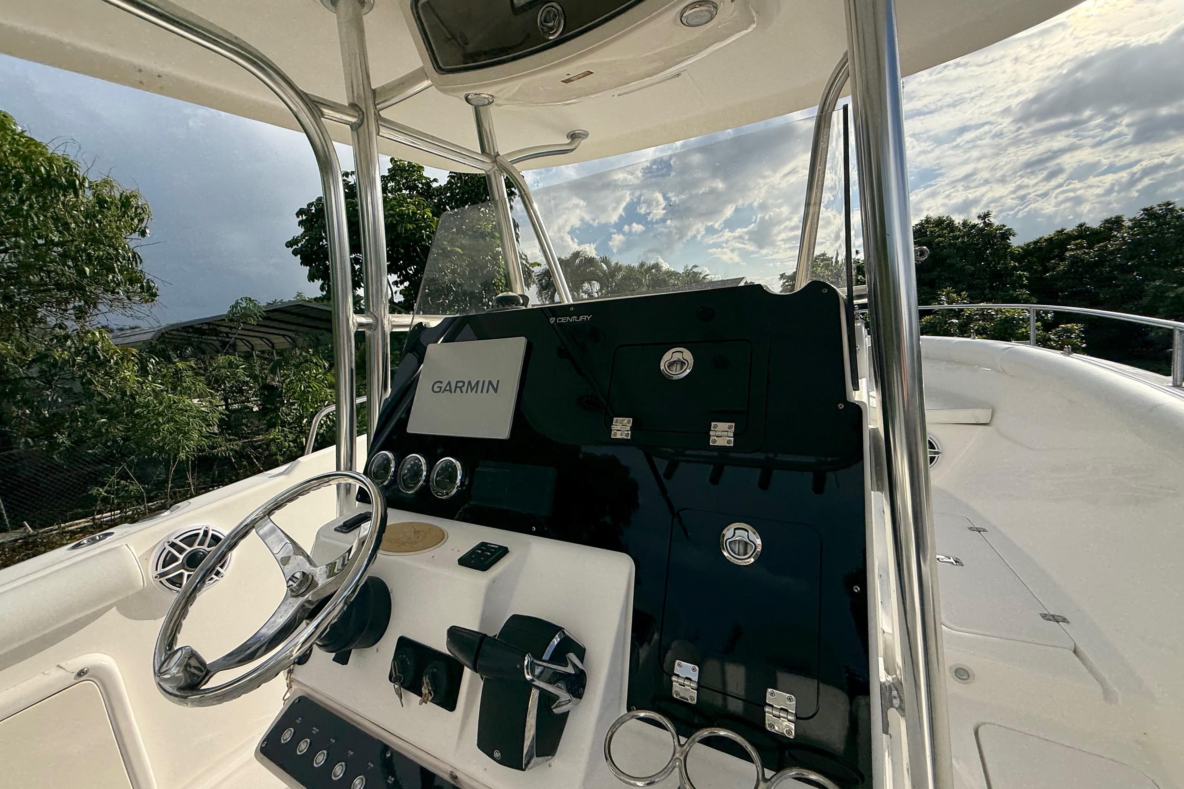 2007 Century 3200 Center Console boat dashboard with Garmin navigation system.
