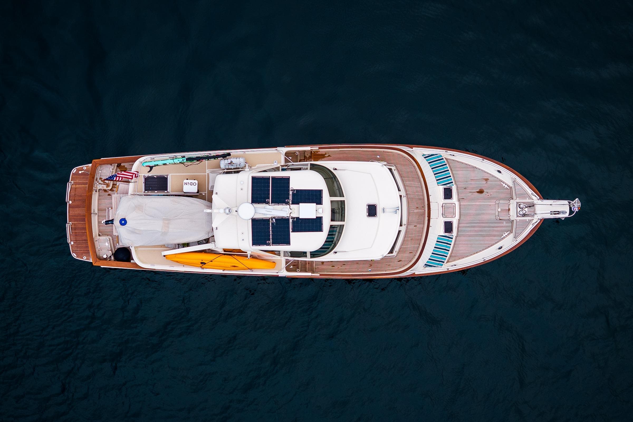Aerial view of 2026 Fleming 55 Pilothouse yacht with solar panels and kayaks.