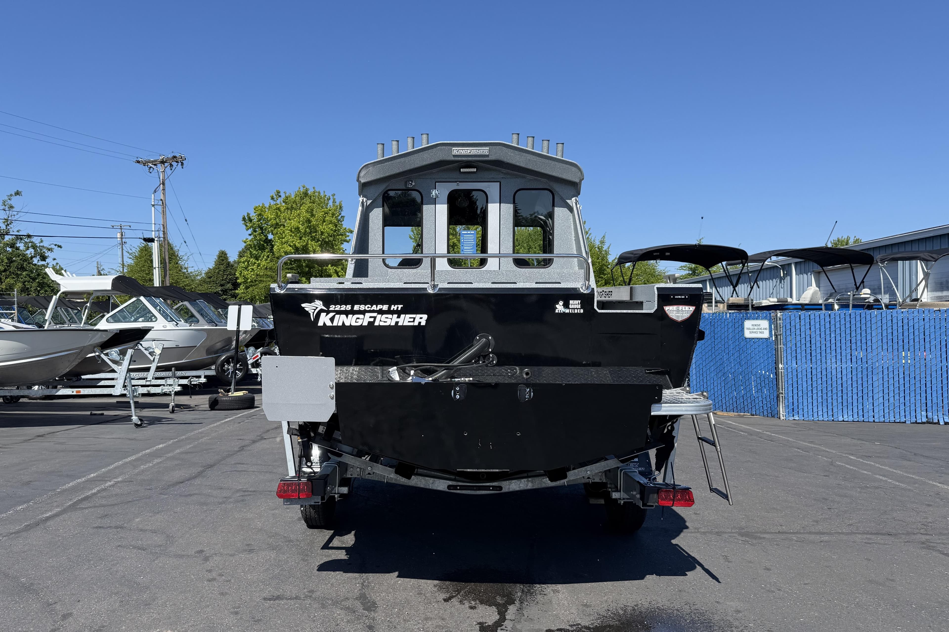 2025 KingFisher 2225 Escape HT boat displayed in a marina setting.