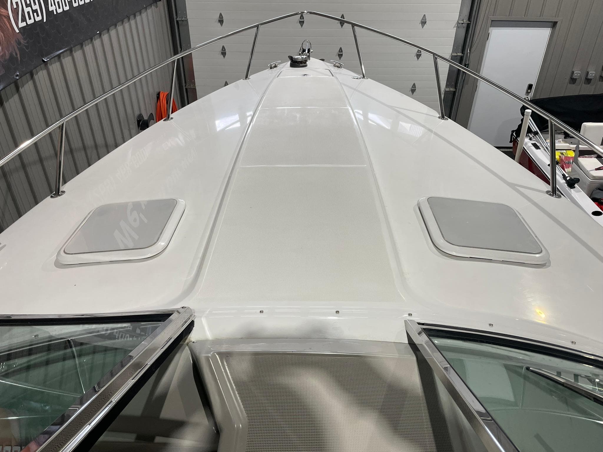 2006 Formula 330 Sun Sport boat deck in a garage setting.