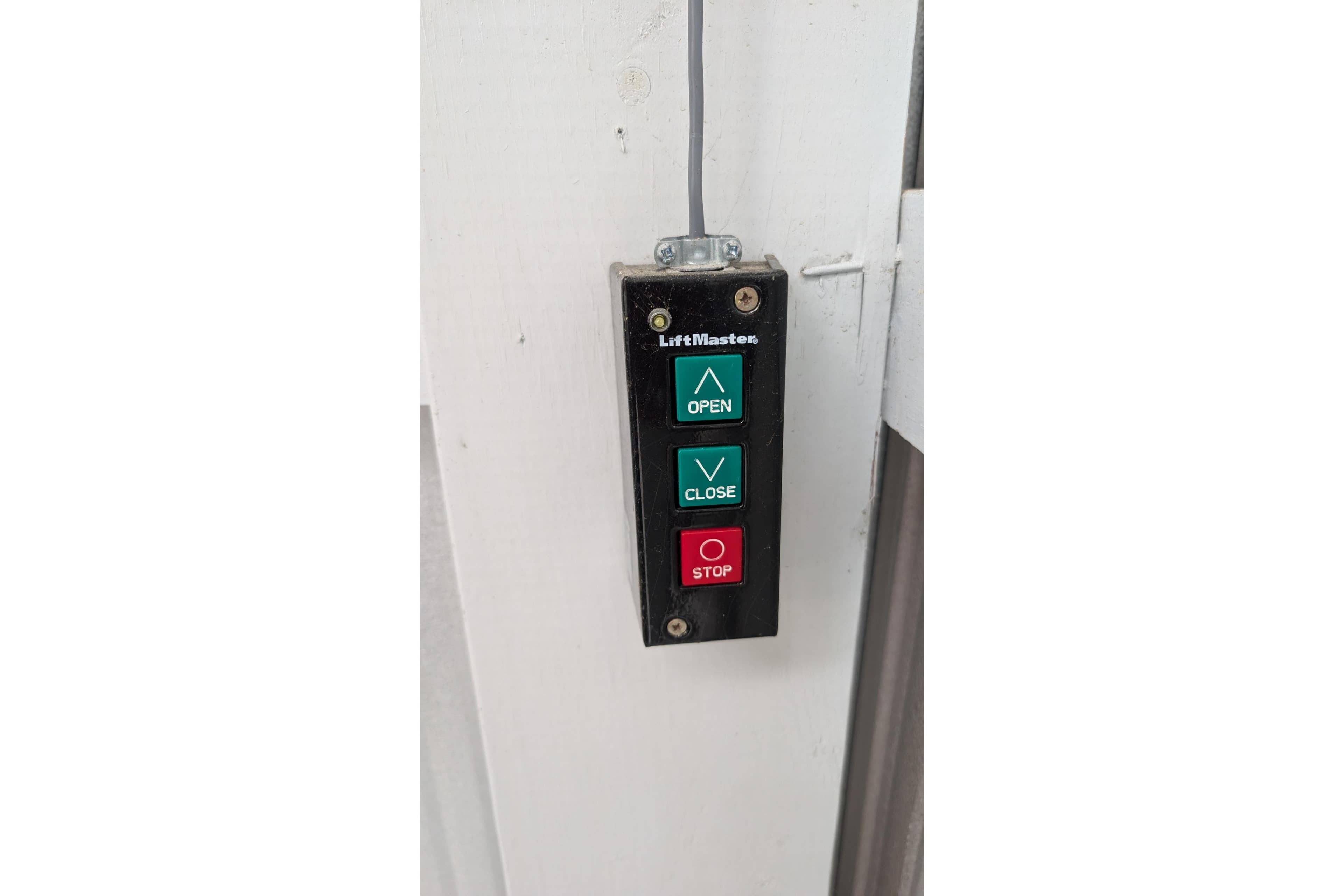 Control panel with open, close, and stop buttons on Eventide Boathouse, 2023 model.