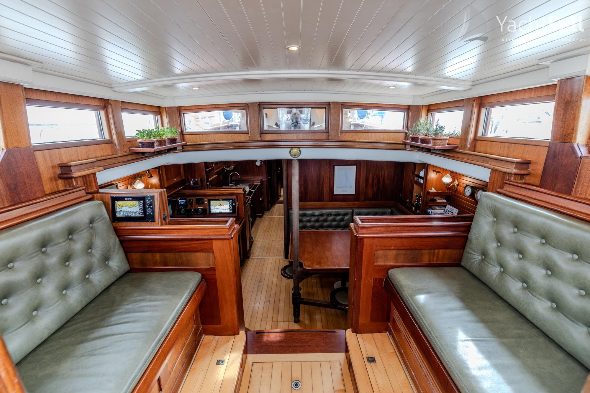 Luxurious interior of 2003 Bestevaer 65 yacht with wooden finishes and leather seating.