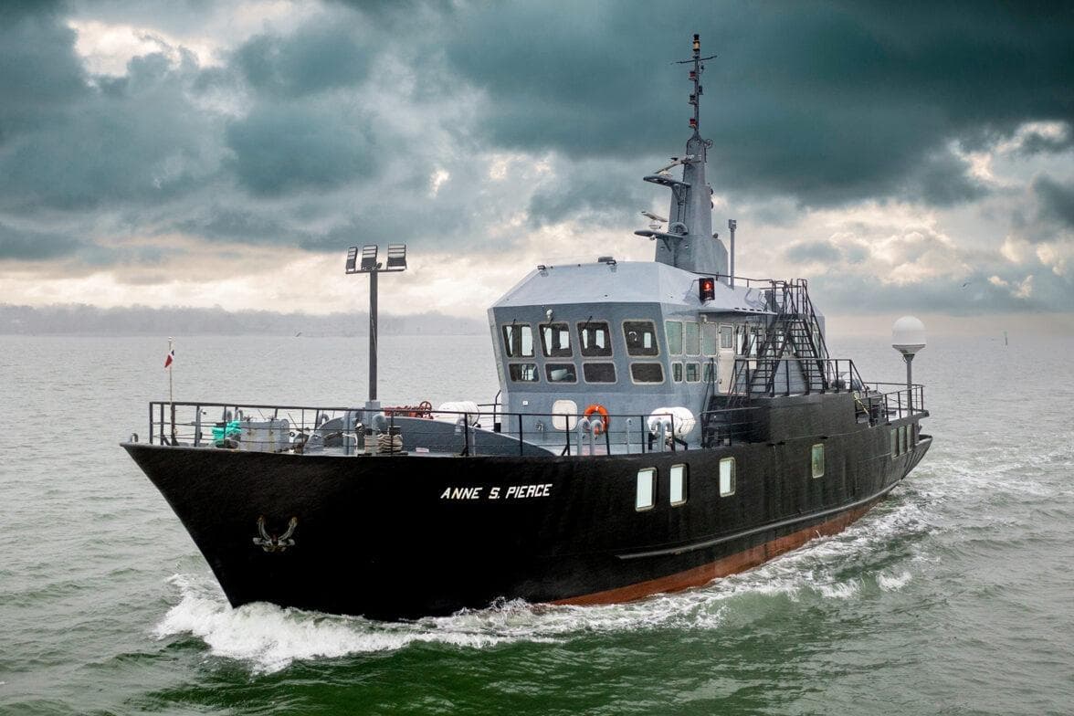 1982 Glovertown Shipyard exploration ship navigating under cloudy skies.