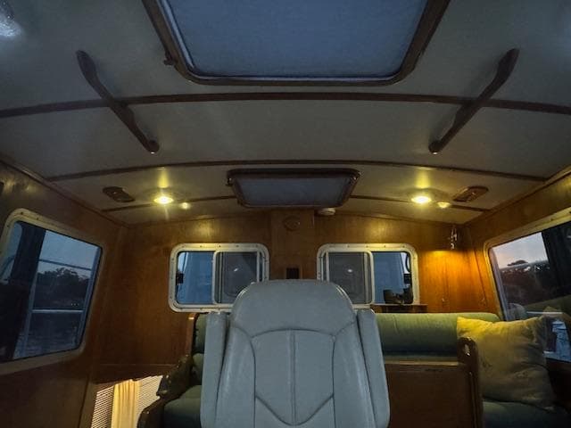 Interior of 1998 Cherubini 50 Independence boat with wood paneling and seating.