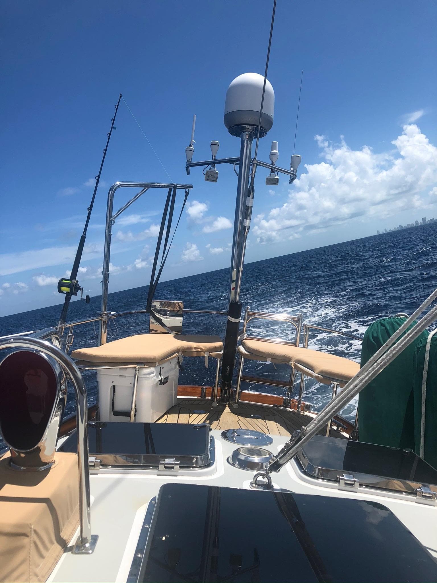 1989 Little Harbor 54 sailboat deck with ocean view under clear blue sky.
