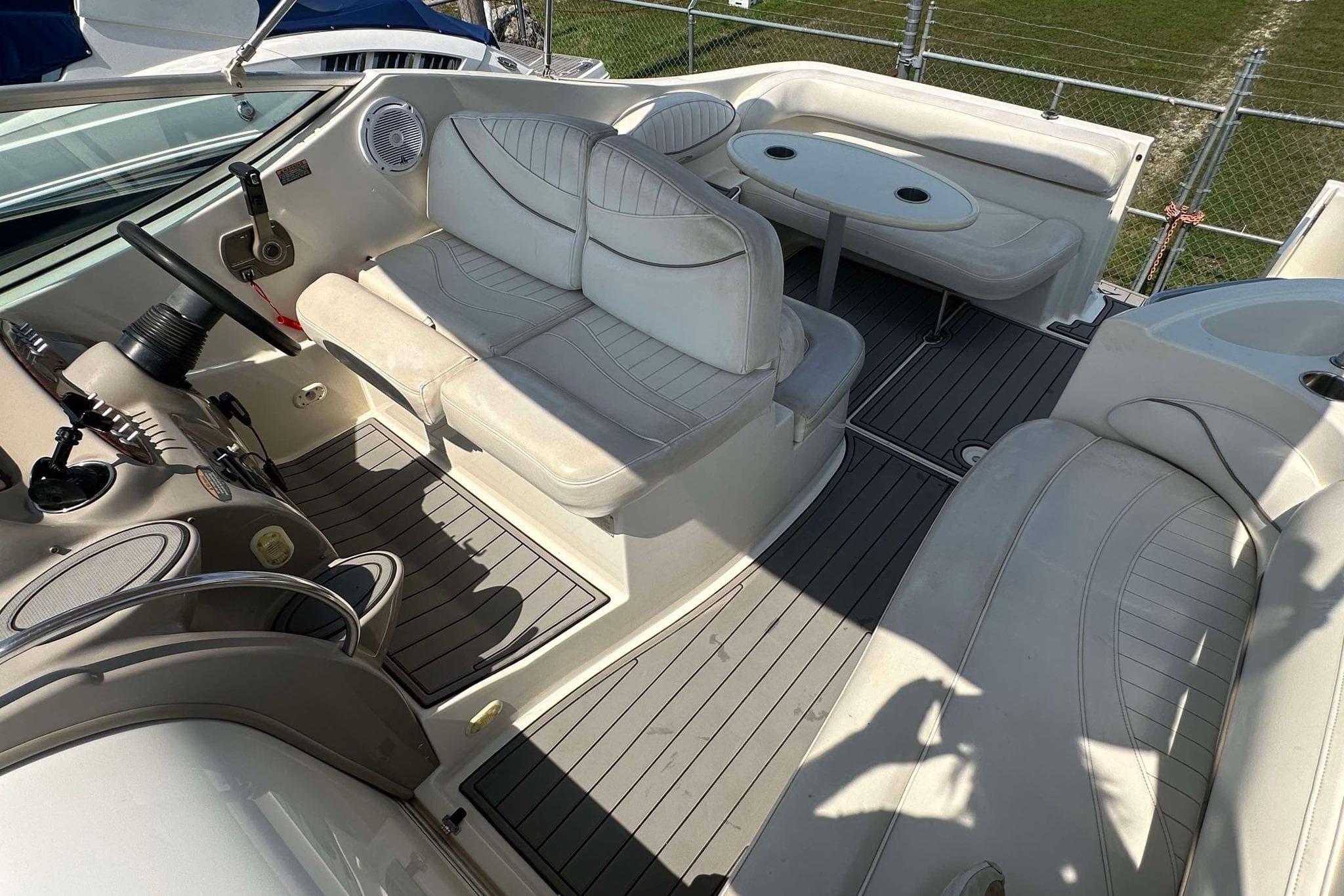 Interior of 2000 Maxum 2700 SCR boat with seating and steering wheel.