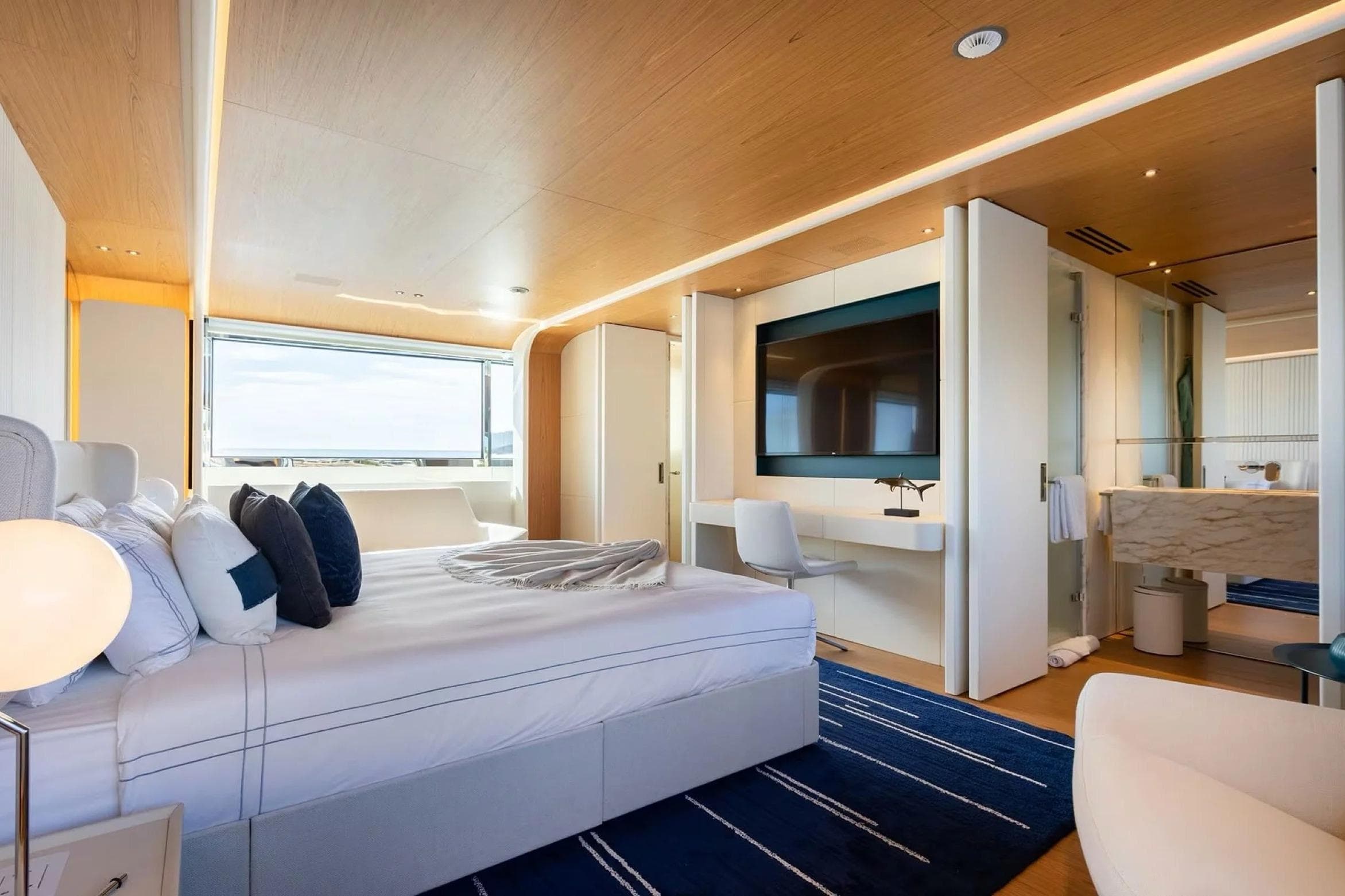 Luxurious bedroom interior of 2022 Benetti Motopanfilo 37 yacht, featuring modern design and elegant furnishings.
