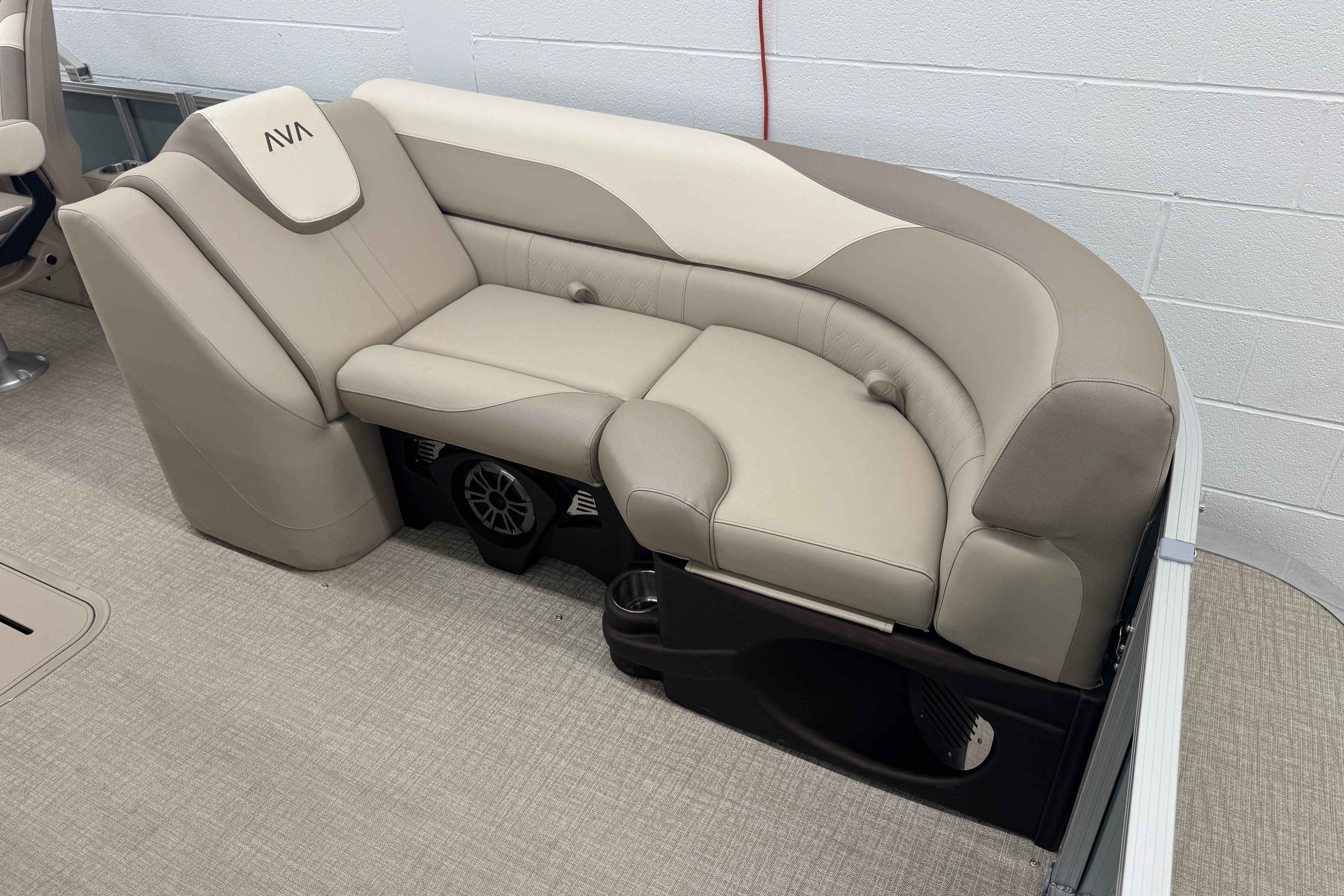 Luxurious seating in 2026 Avalon LSZ QLS boat, featuring beige upholstery and integrated speakers.