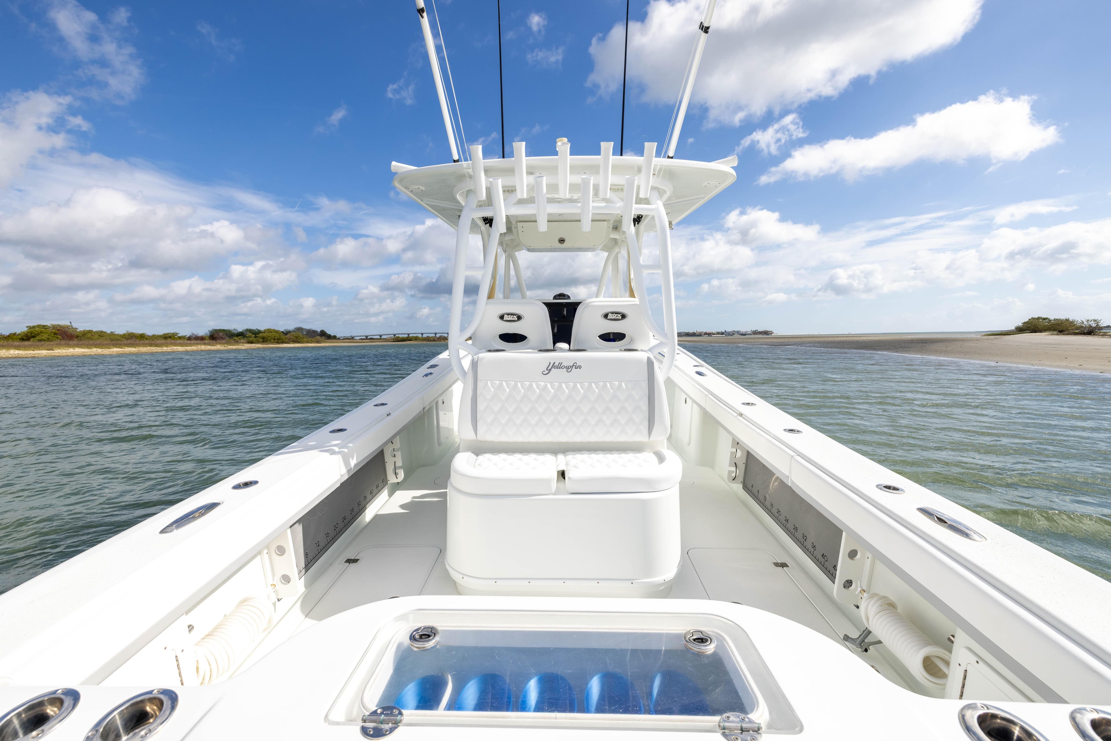 2014 Yellowfin 32 Offshore boat on calm waters under a blue sky.