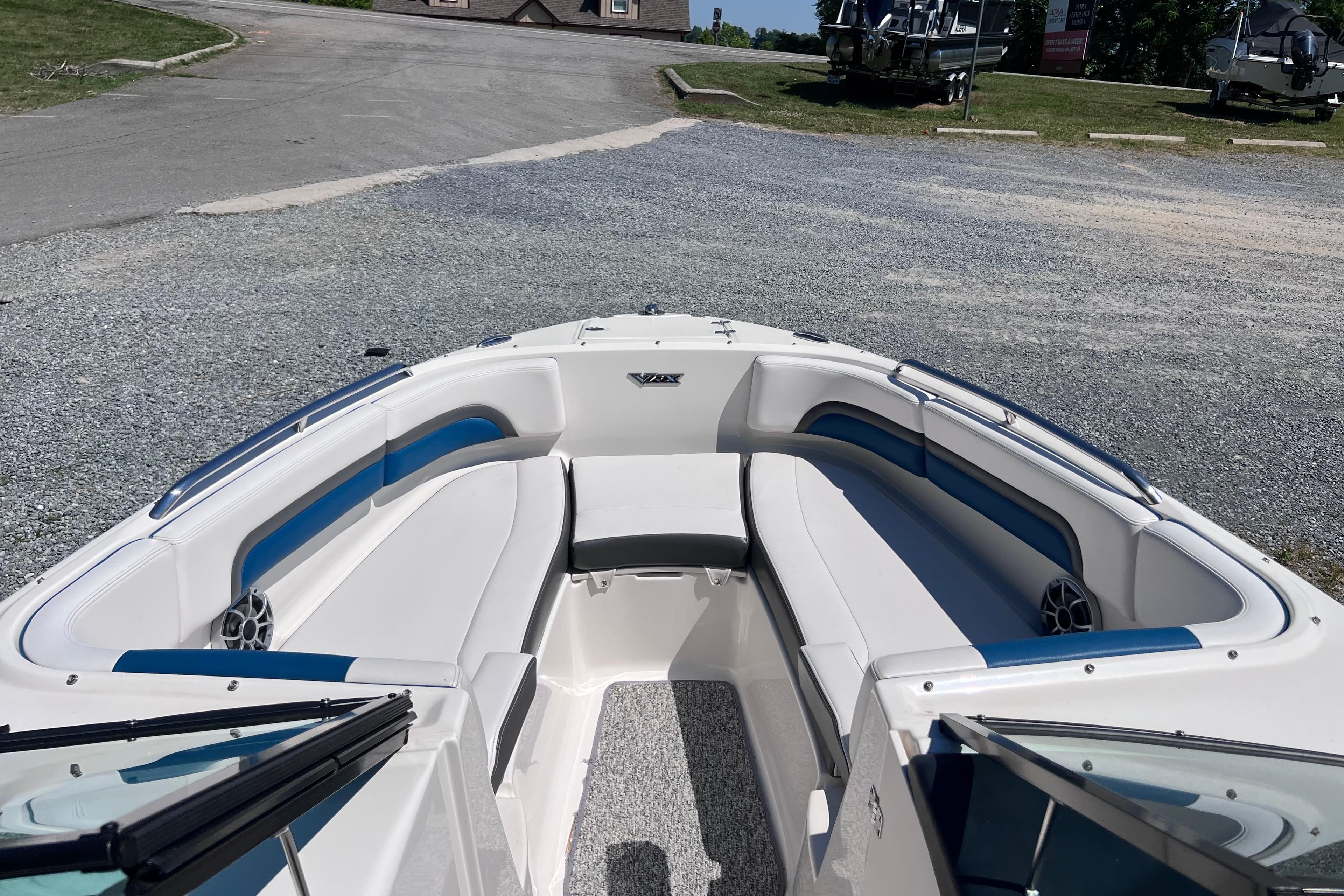 2016 Chaparral Vortex 243 VRX boat interior with white and blue seating.