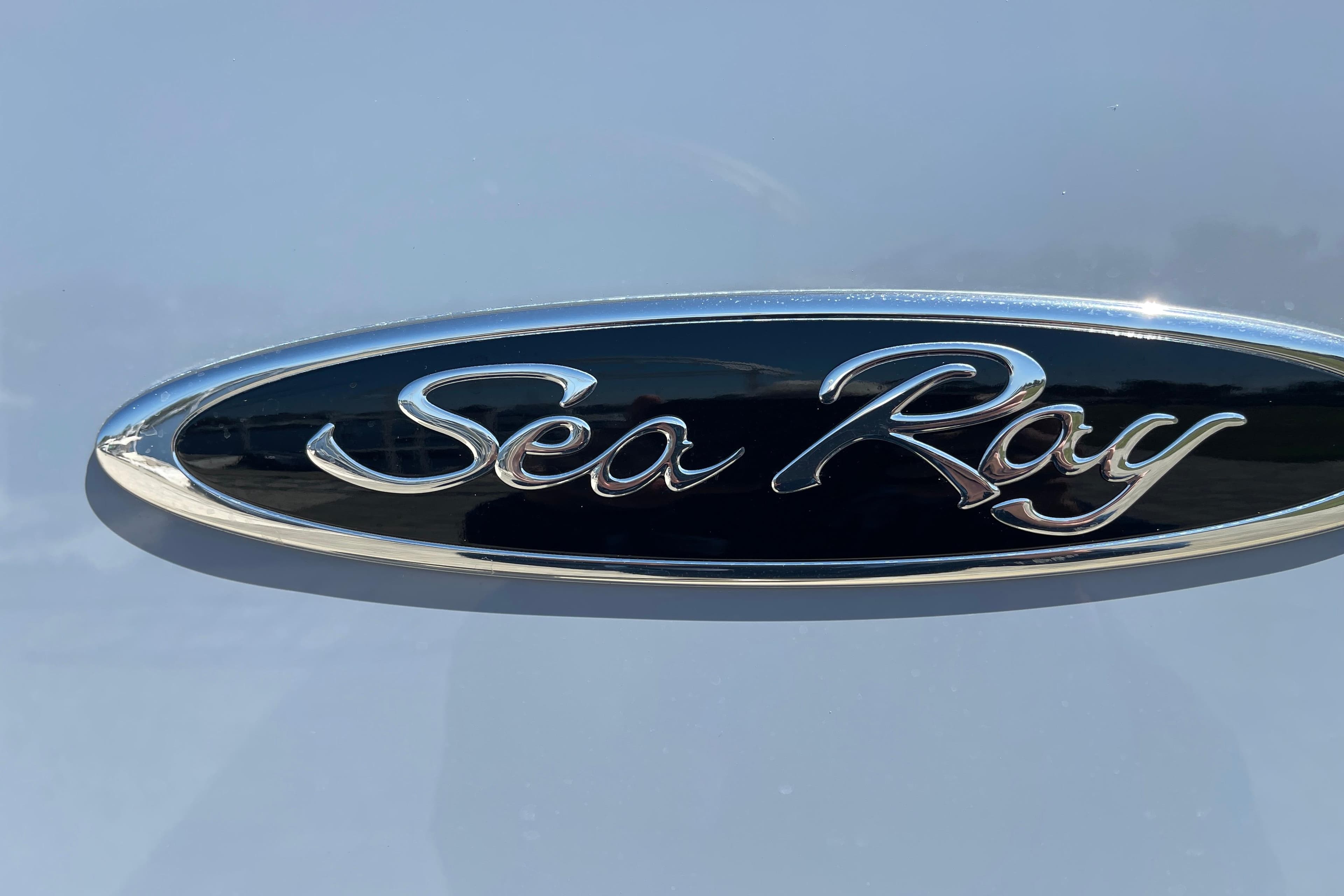 Chrome Sea Ray logo on 2023 SDX 290 Outboard boat.