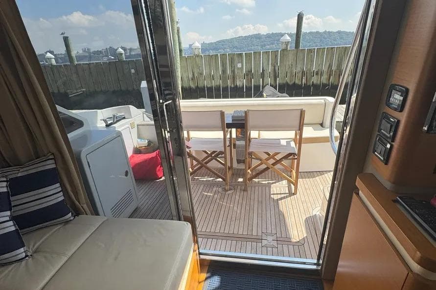 Interior view of 2014 Azimut 45 yacht with outdoor seating area.