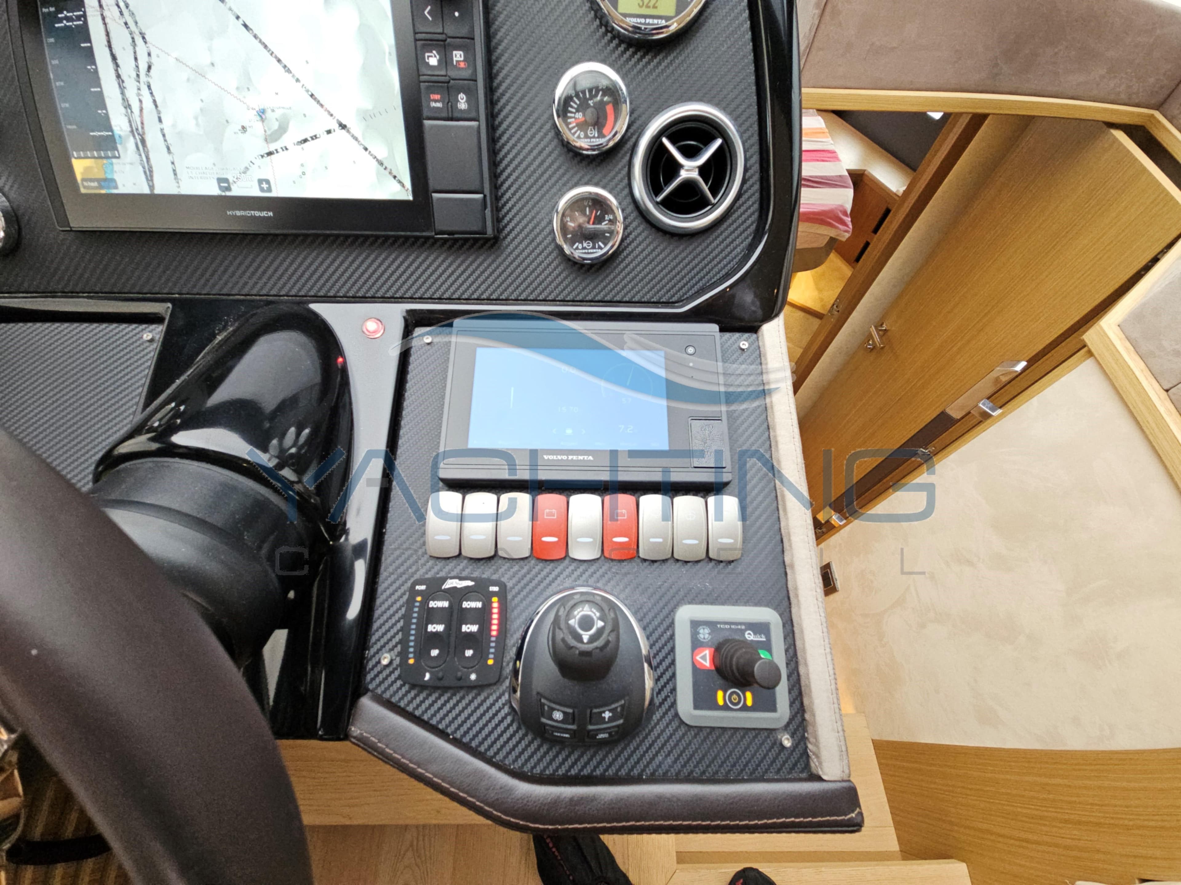 Control panel of a 2018 Absolute 45 FLY yacht with navigation and control instruments.