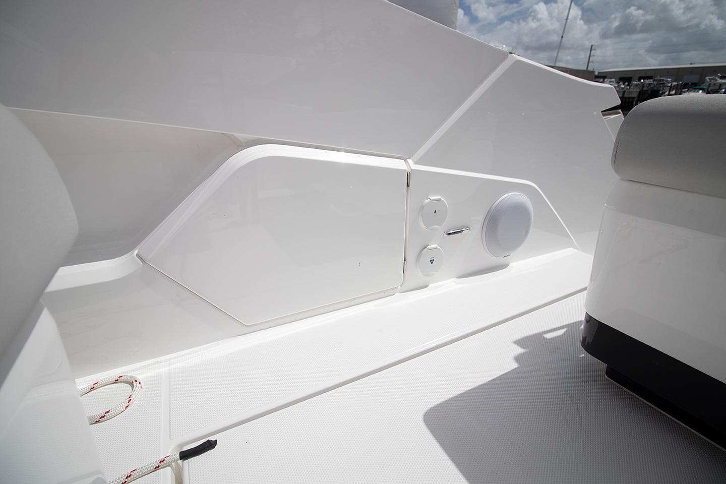 2021 Fairline F Line 33 yacht deck with storage compartment and speaker.
