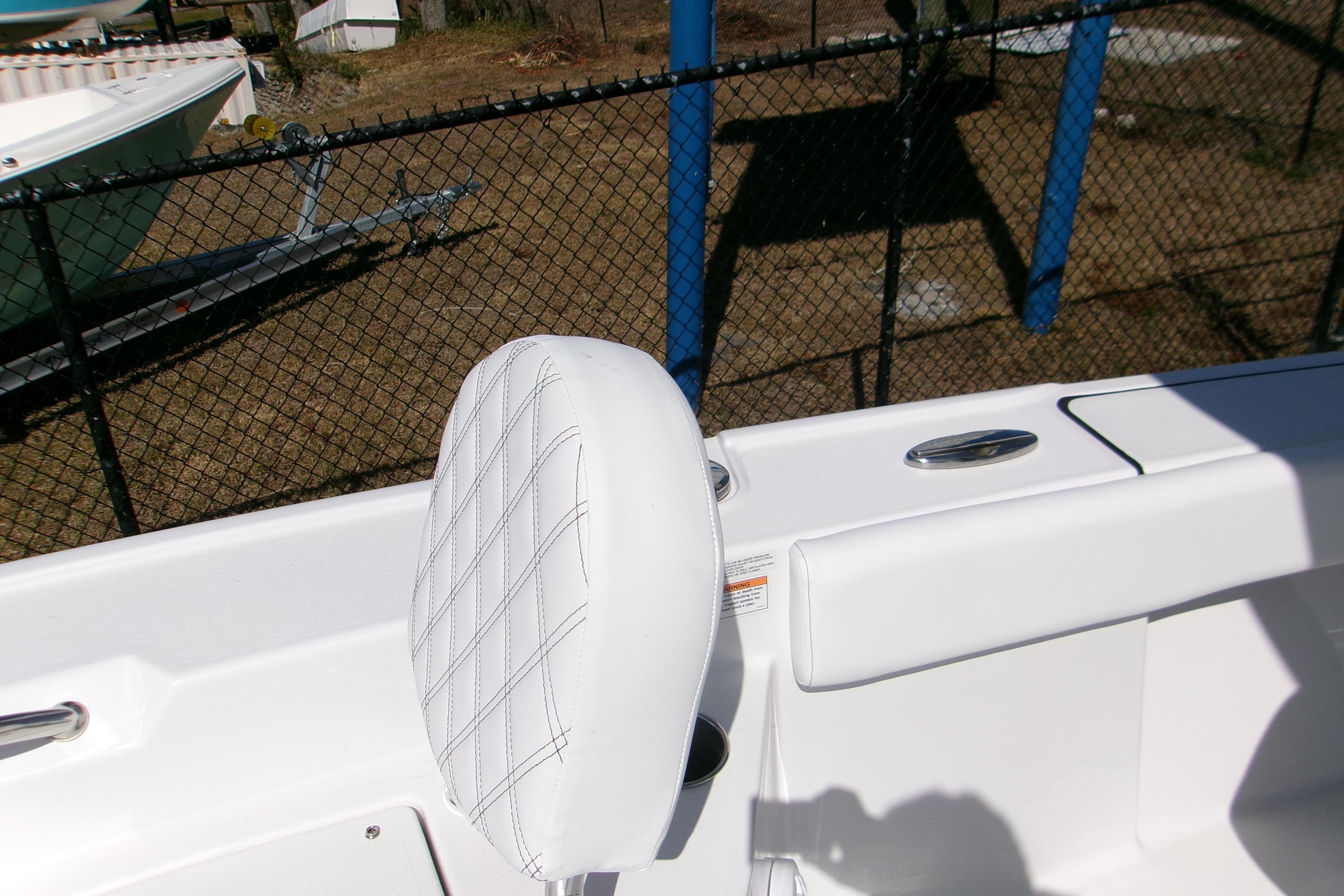 2026 Sportsman Masters 267OE Bay Boat interior with white cushioned seating.