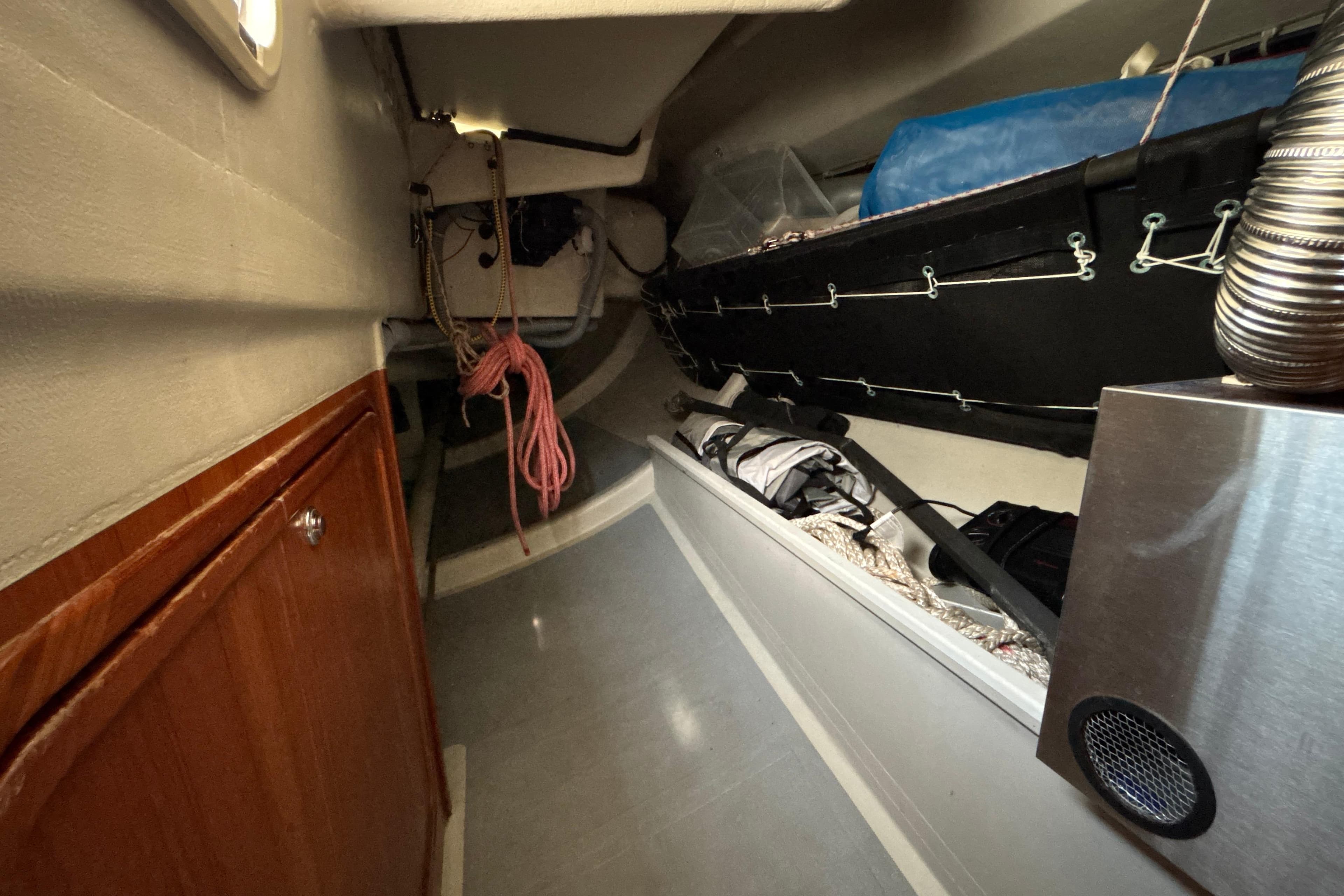 Interior of a 1993 Santa Cruz 52 sailboat, featuring storage and equipment.