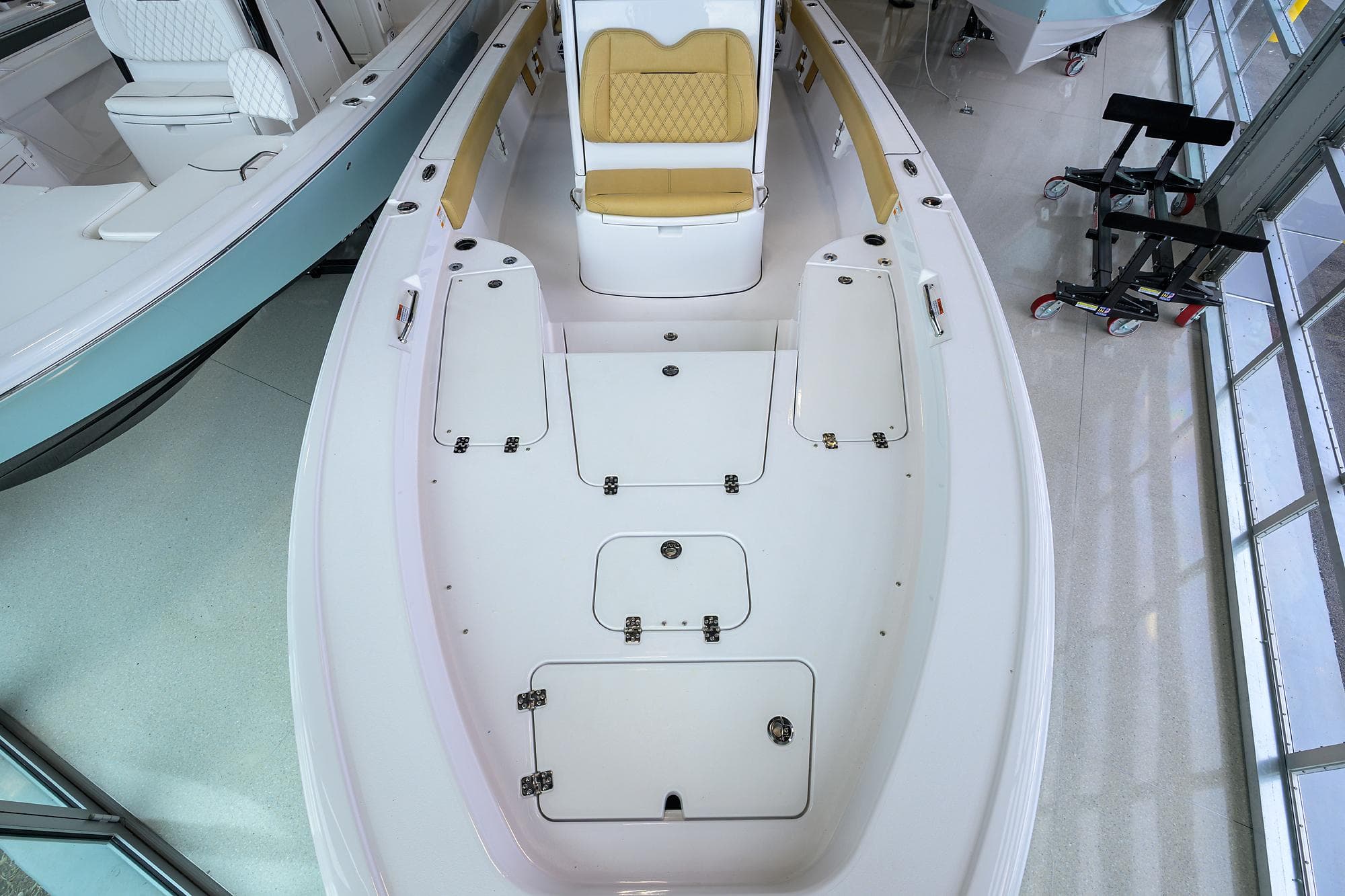 2025 Sportsman Masters 267 Bay Boat interior with seating and storage compartments.