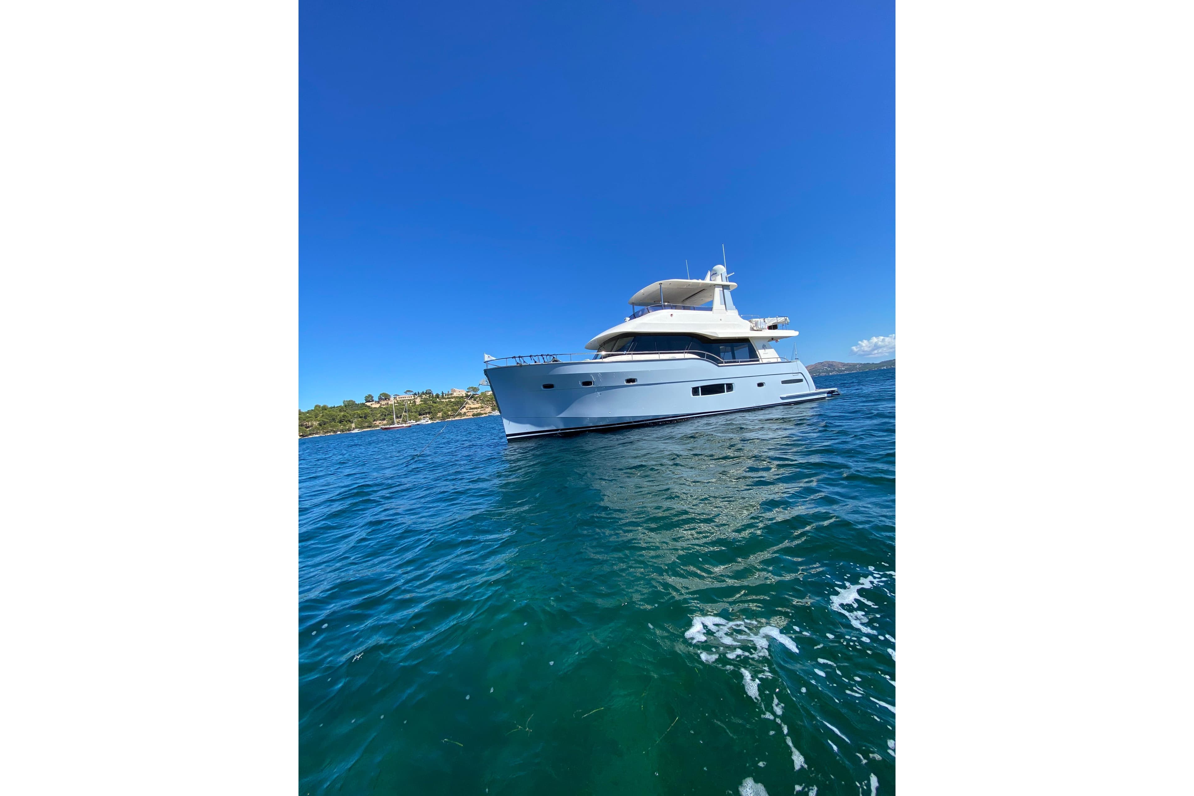 2016 Outer Reef Trident 620 yacht on clear blue water under a bright sky.