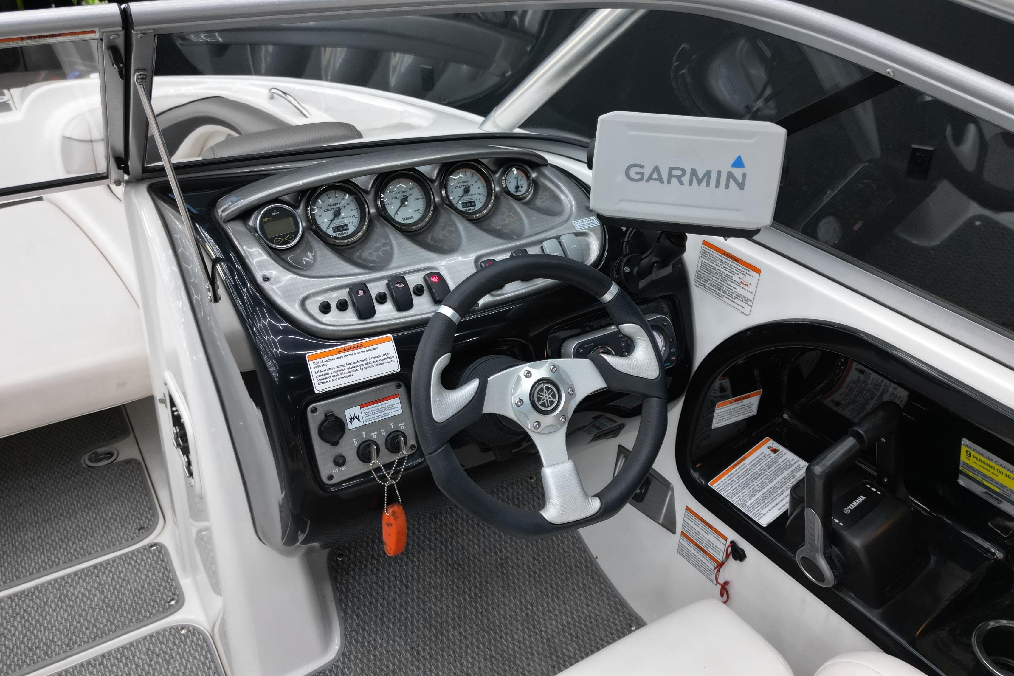 2008 Yamaha Boats 212X dashboard with Garmin navigation system and steering wheel.