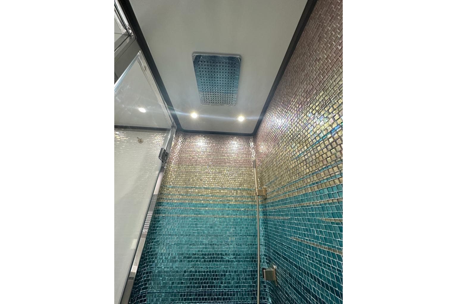 Luxurious shower with mosaic tiles in 2024 Uniesse Exuma HTC5p yacht.