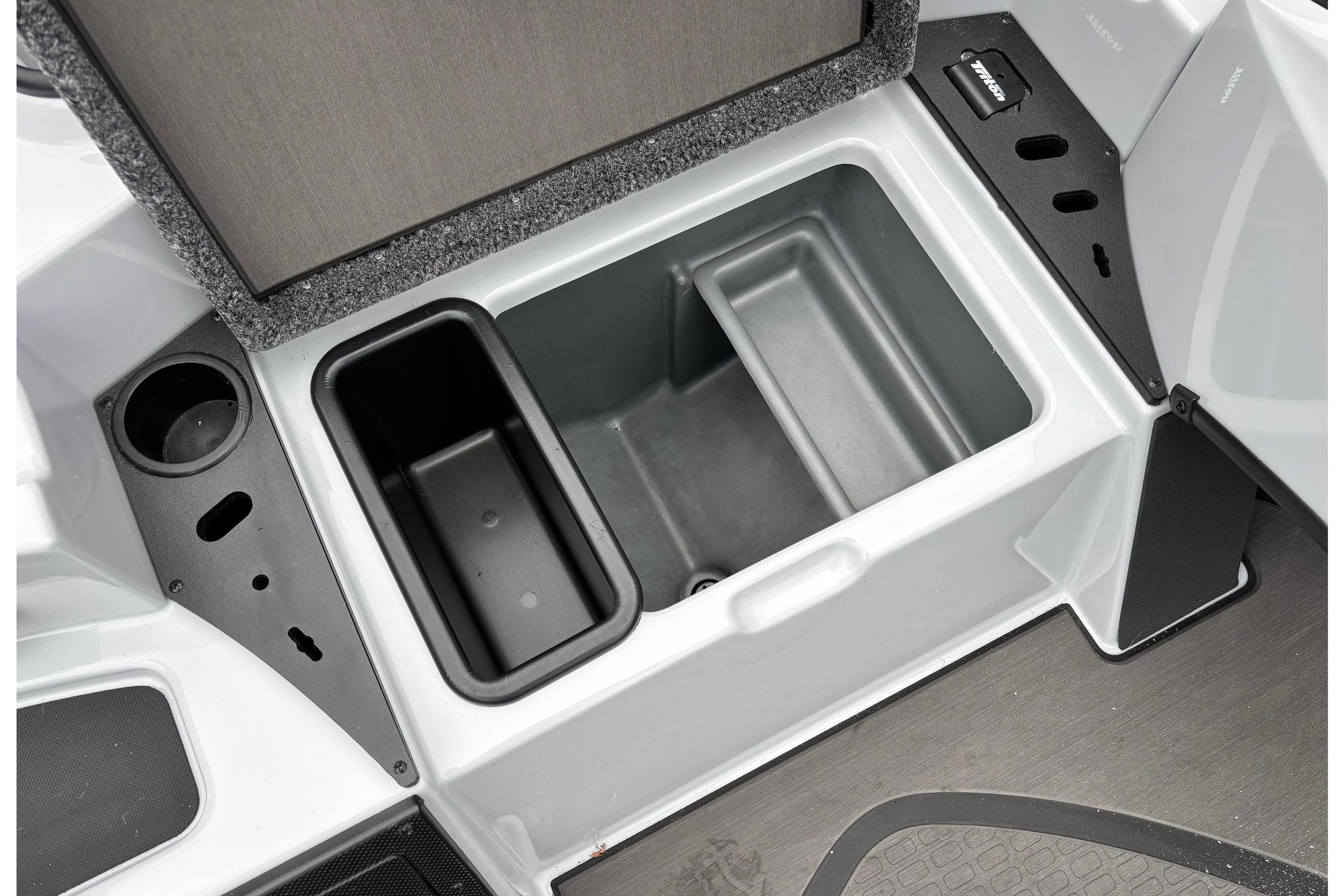 2026 Triton 20XP Patriot boat storage compartment with cup holder and organizer.