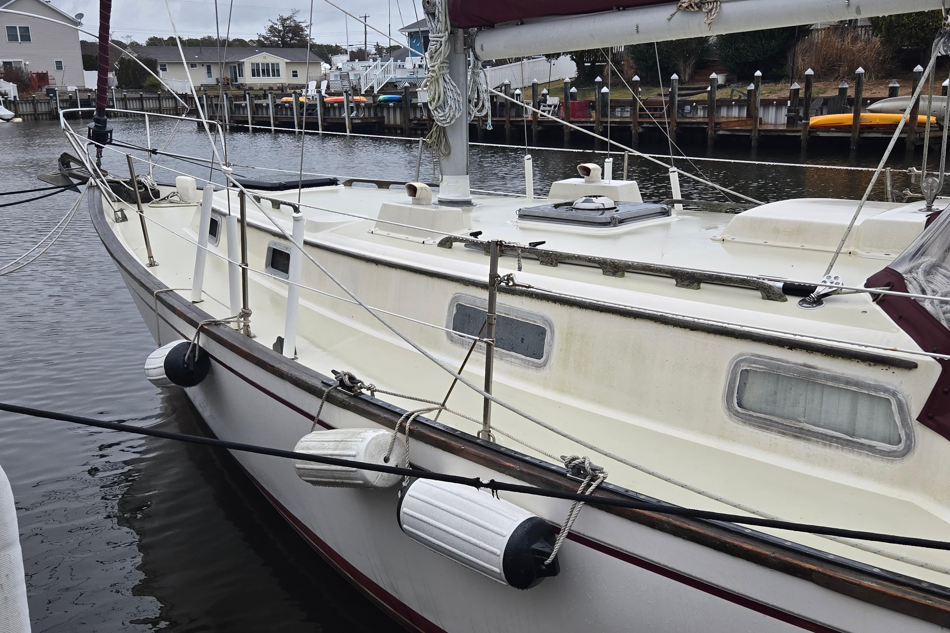 1980 Pearson 365 Sloop docked in a marina, showcasing its classic design and rigging.