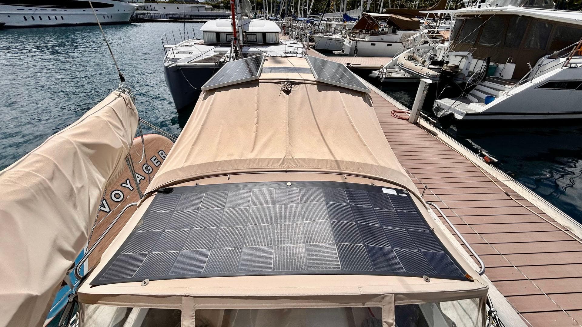 1996 J Boats J/42 sailboat docked, featuring solar panels on the deck.