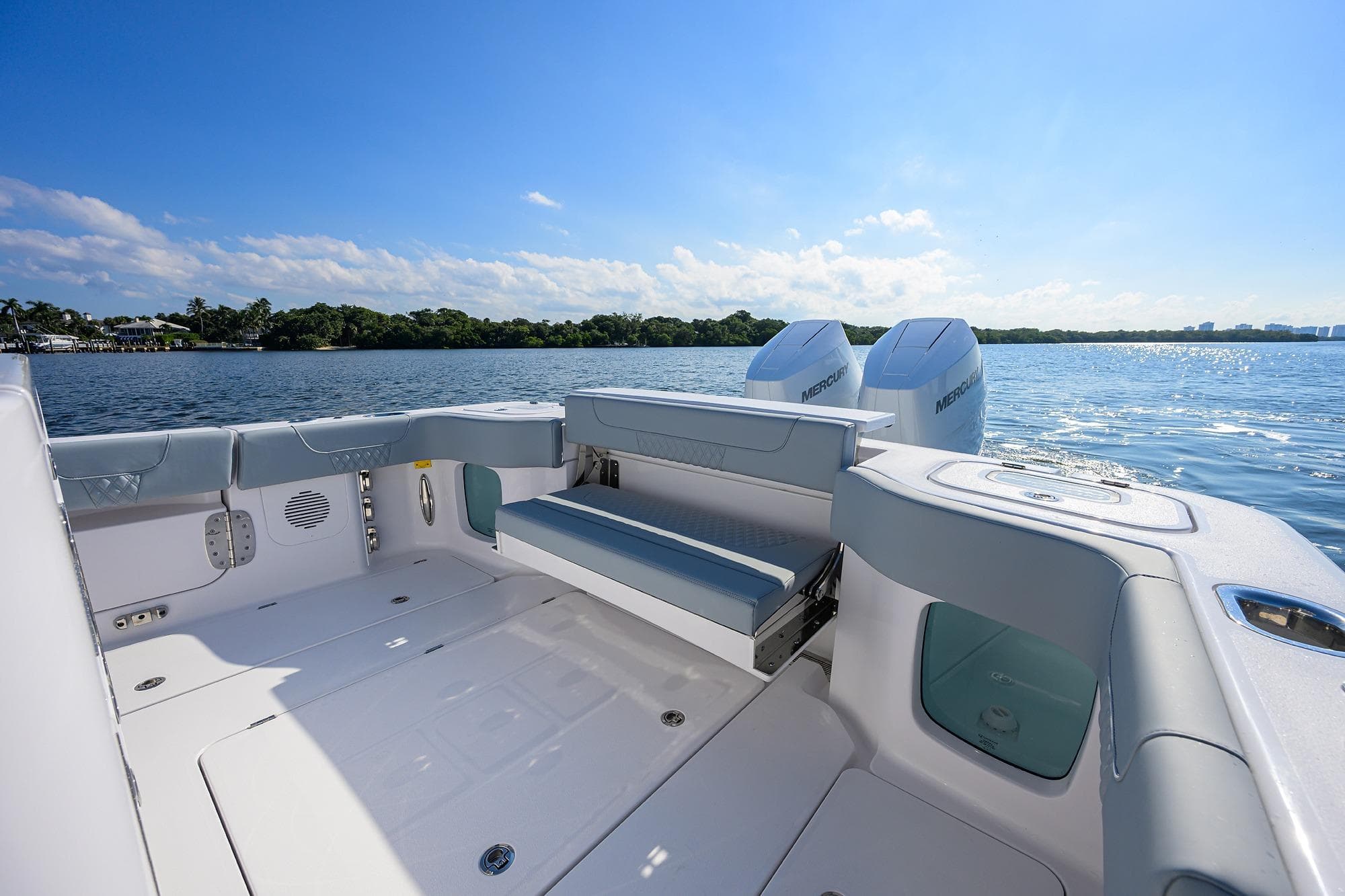 2026 Phenom 34 Center Console boat with spacious deck and twin Mercury engines on a sunny day.