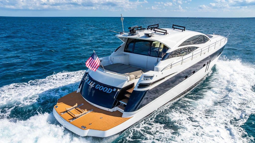 2006 Pershing 62 luxury yacht cruising on open sea.