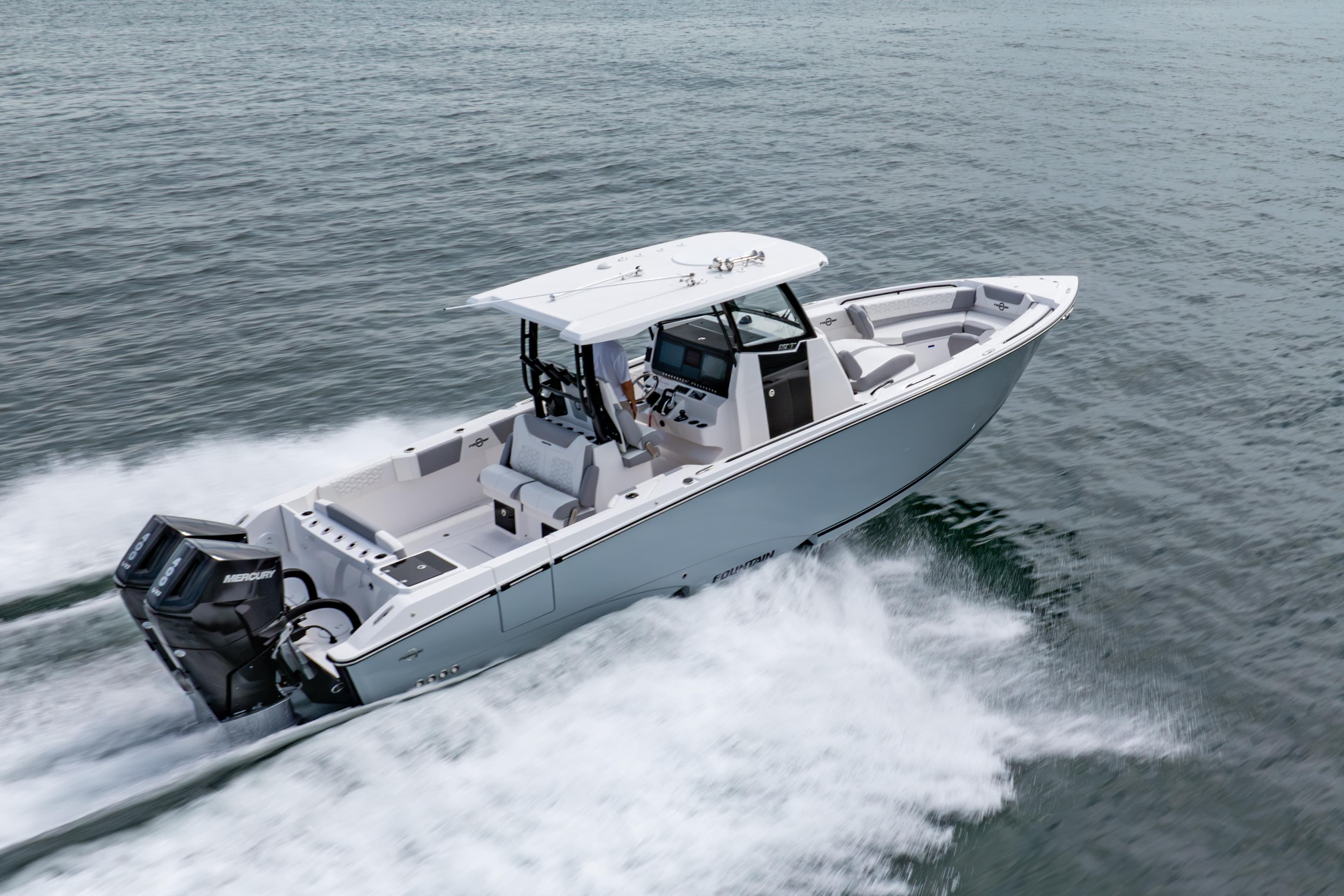 2025 Fountain 32 NX boat cruising on open water, showcasing sleek design and powerful engines.