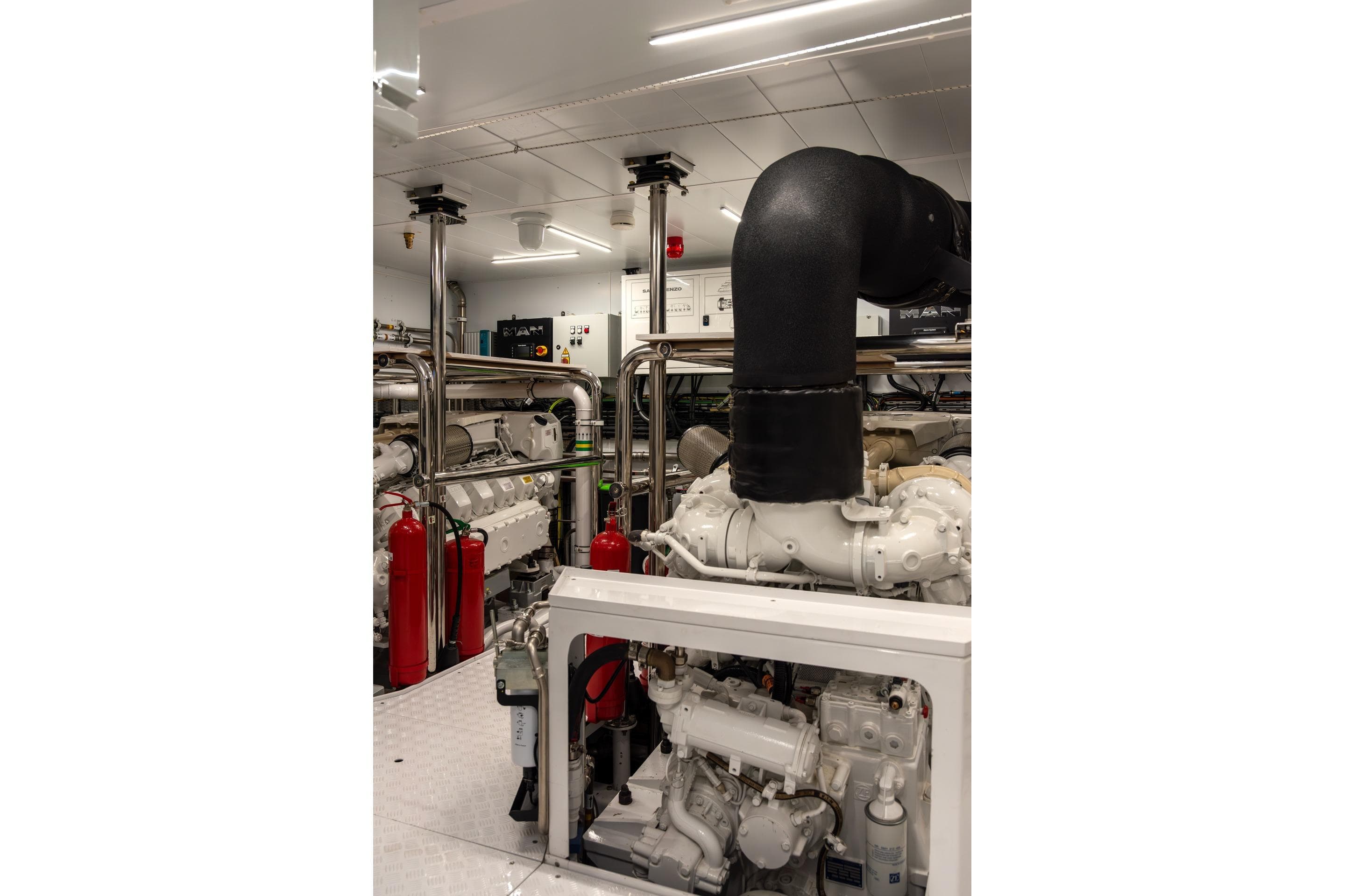 Engine room of 2025 Sanlorenzo SD118 yacht with advanced machinery and piping.