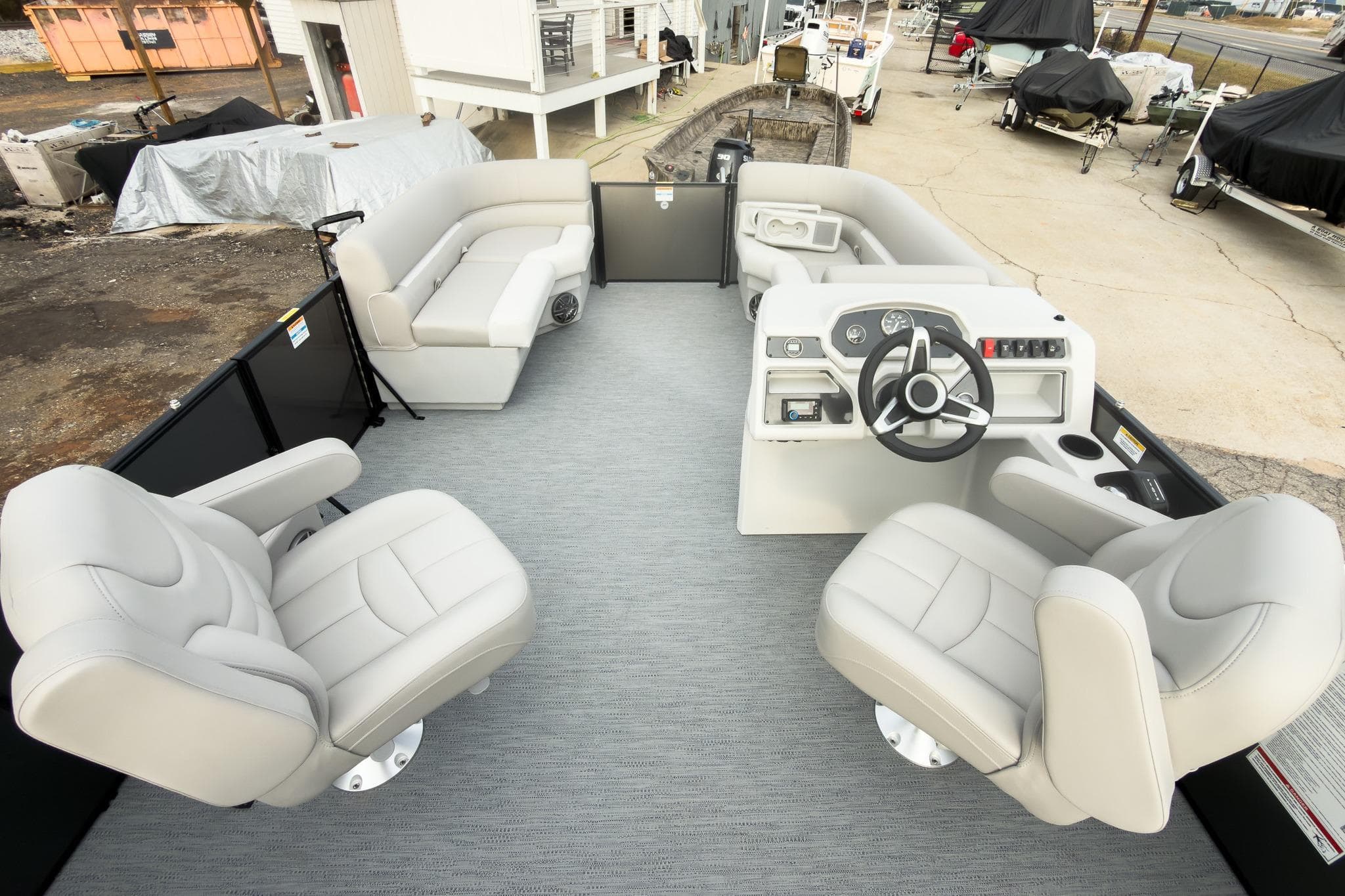 2026 Godfrey Sweetwater Xperience 22' Tritoon interior with plush seating and modern helm.