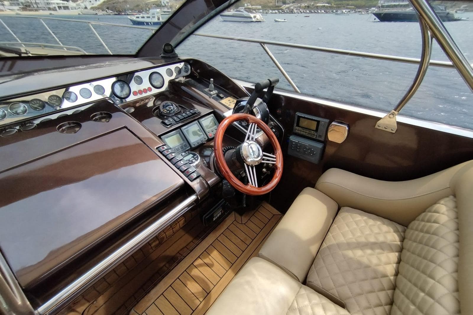 Luxurious 1996 Princess V52 yacht cockpit with leather seating and advanced navigation controls.