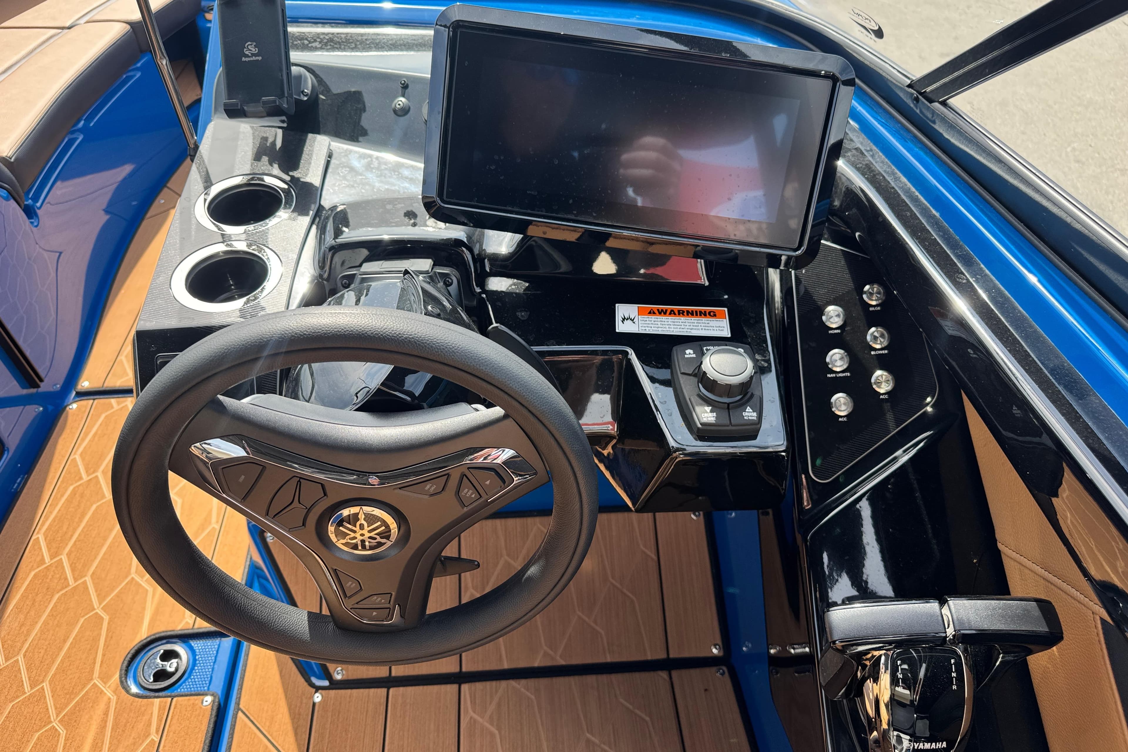 2026 Yamaha Boats 255XD dashboard with steering wheel, touchscreen, and controls.