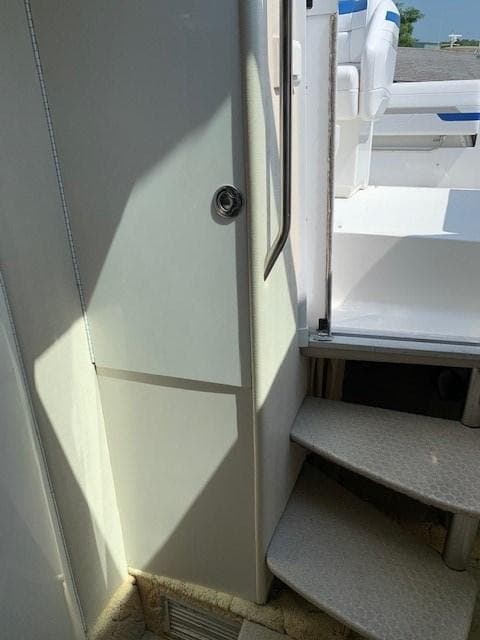 2003 Formula 27 PC boat interior with stairs and seating area.